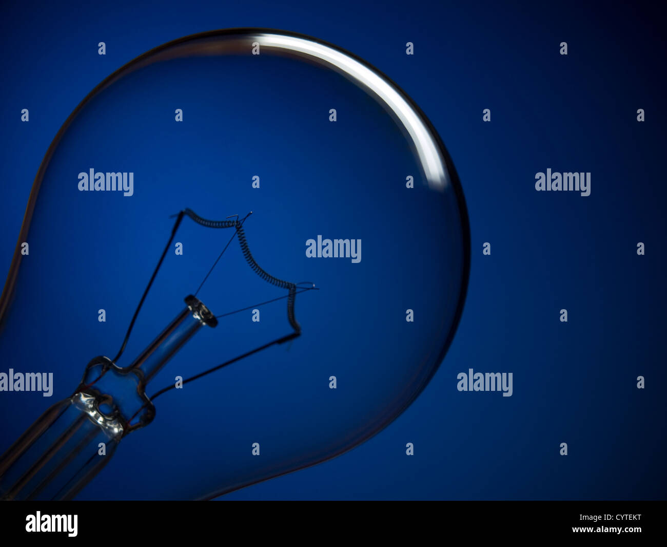 Bulb light over blue Stock Photo Alamy