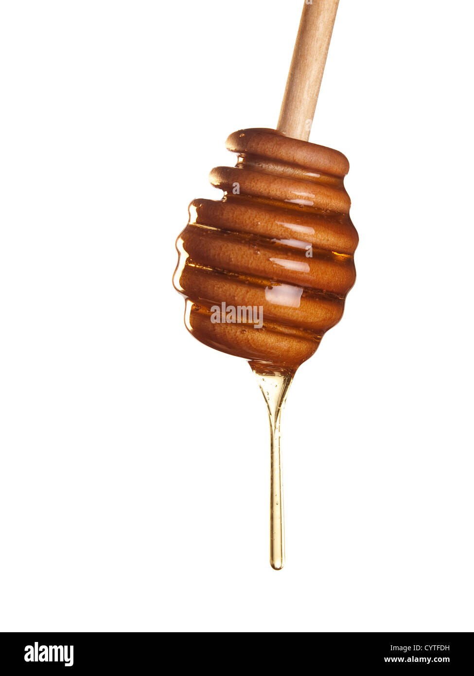 Honey falling down from the wooden honey dipper Stock Photo Alamy