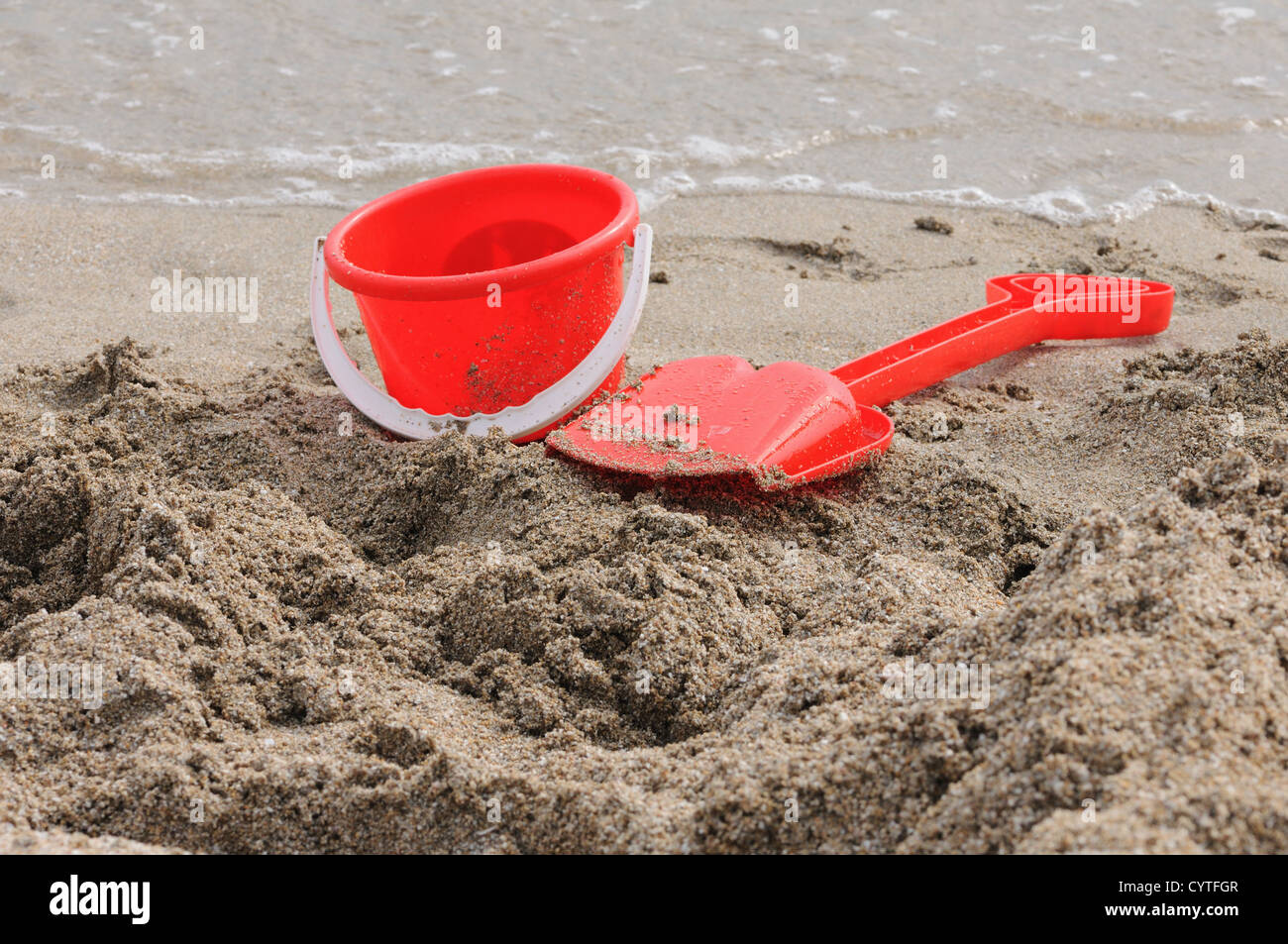 Red Sand Pail and Shovel on a beach Stock Photo Alamy