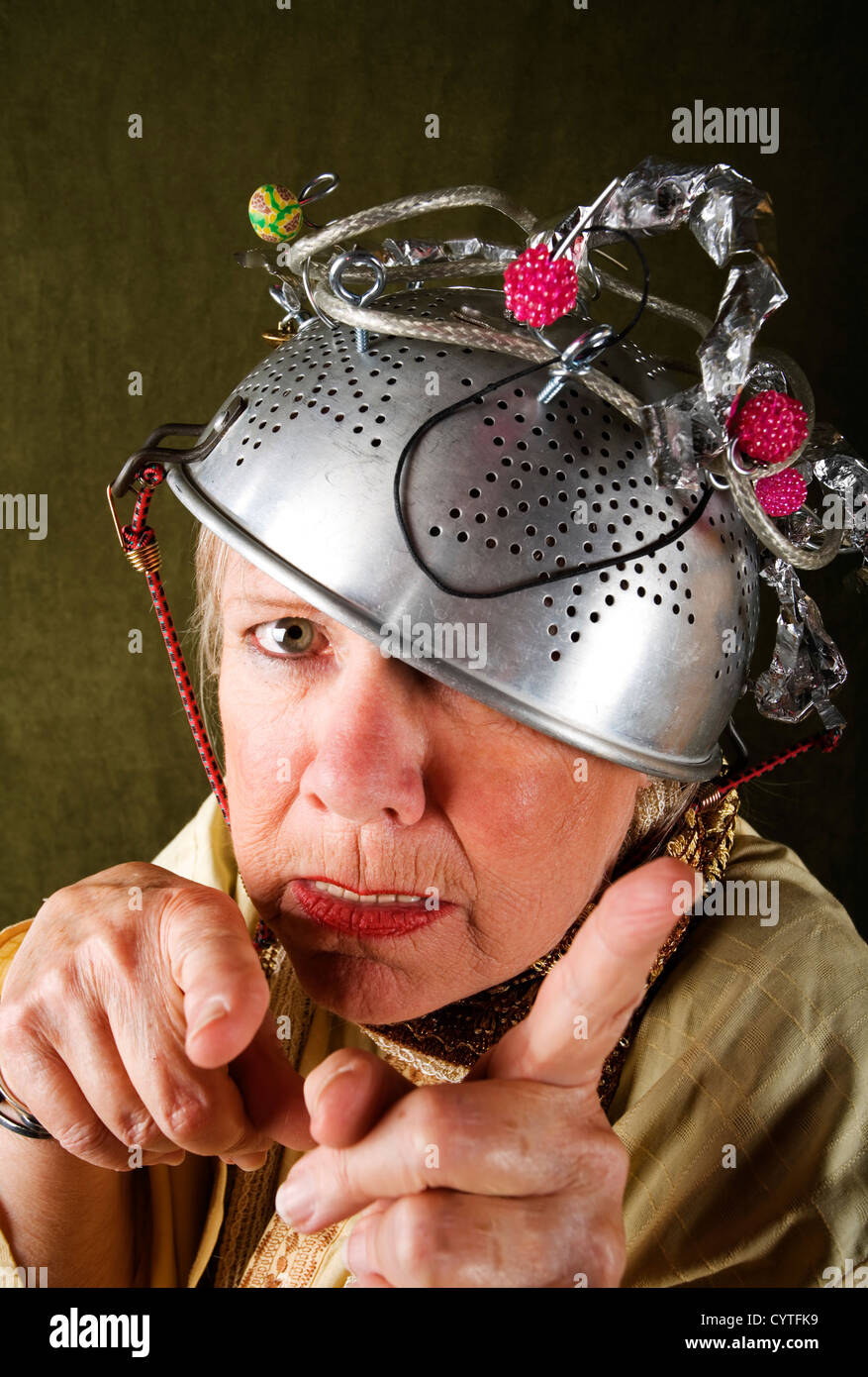 Crazy woman wearing a metal colander for a helmet Stock Photo Alamy