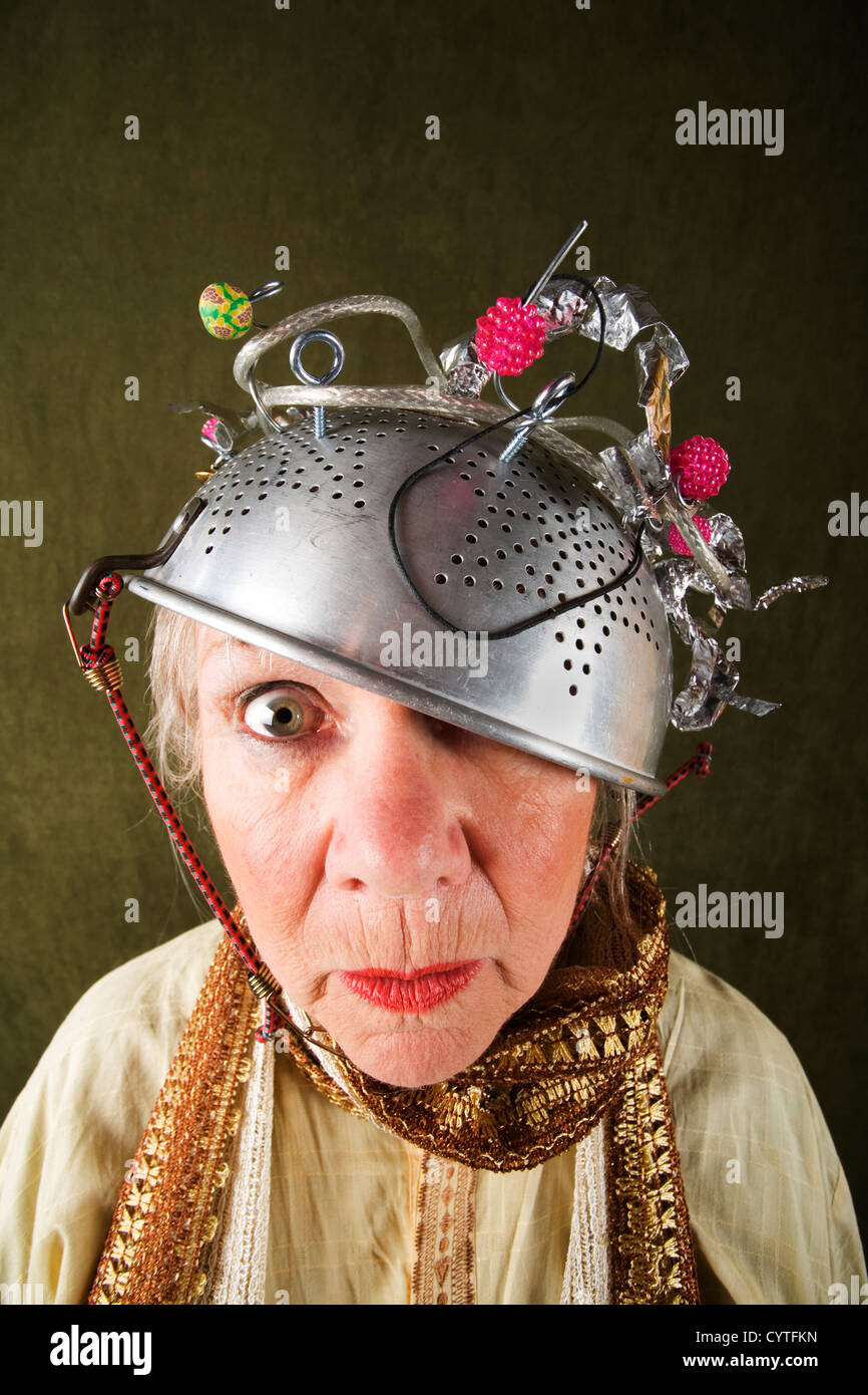 Crazy woman wearing a metal colander for a helmet Stock Photo - Alamy