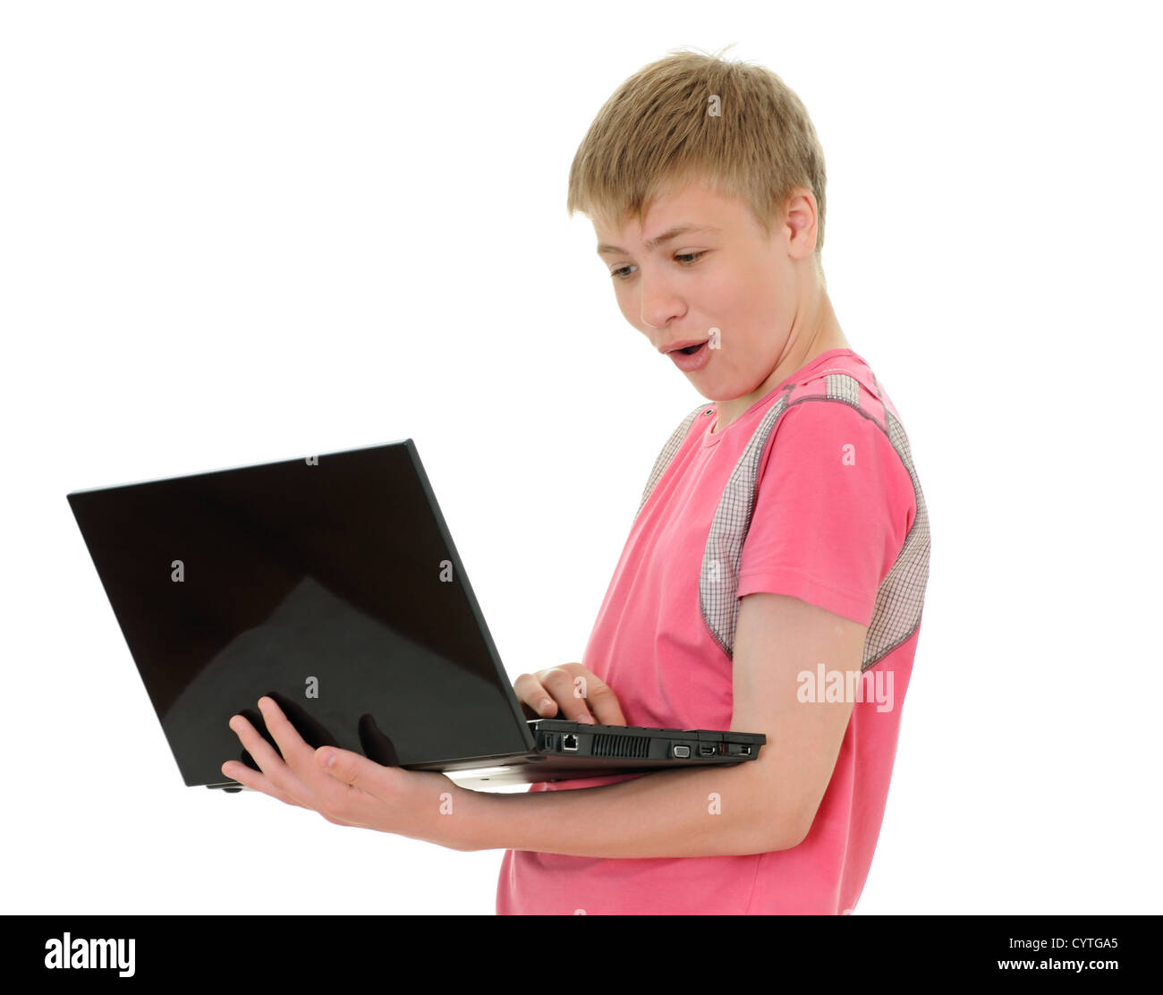 The surprised teenager with laptop isolated on white background Stock ...