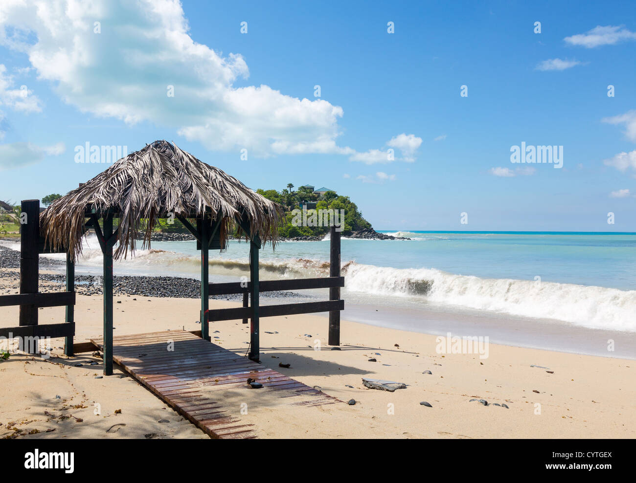 Sand swamping bar seats and table and serving area on Friars bay in St