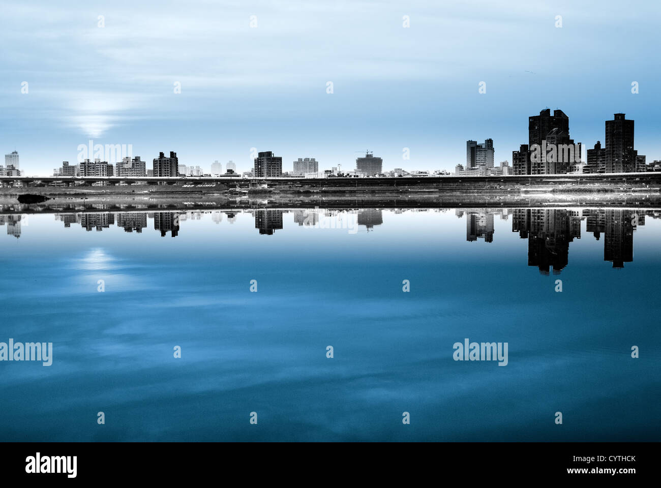 It is a dark and blue city night. Stock Photo