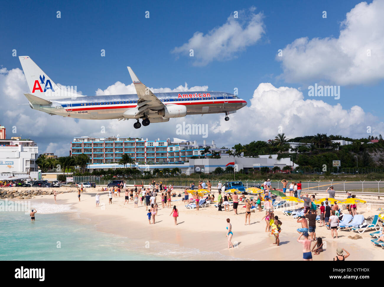 American Airlines Boeing 737 flight lands over Maho beach on November 1, 2012. The 2300m runway is approached over the sea. Stock Photo