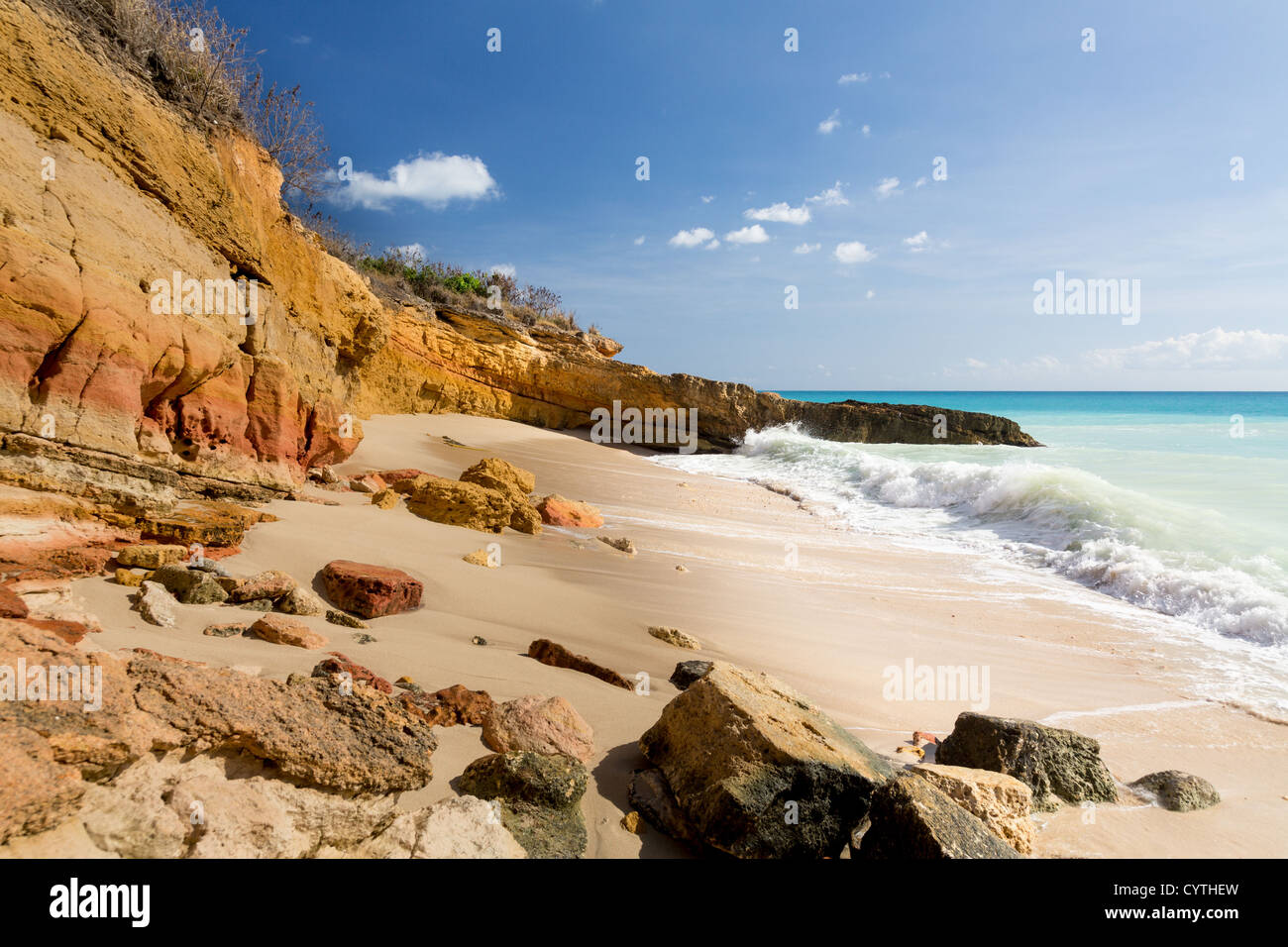 Sandstone cliffs frame Cupecoy Beach on Sint Maarten / St Martin Caribbean Stock Photo