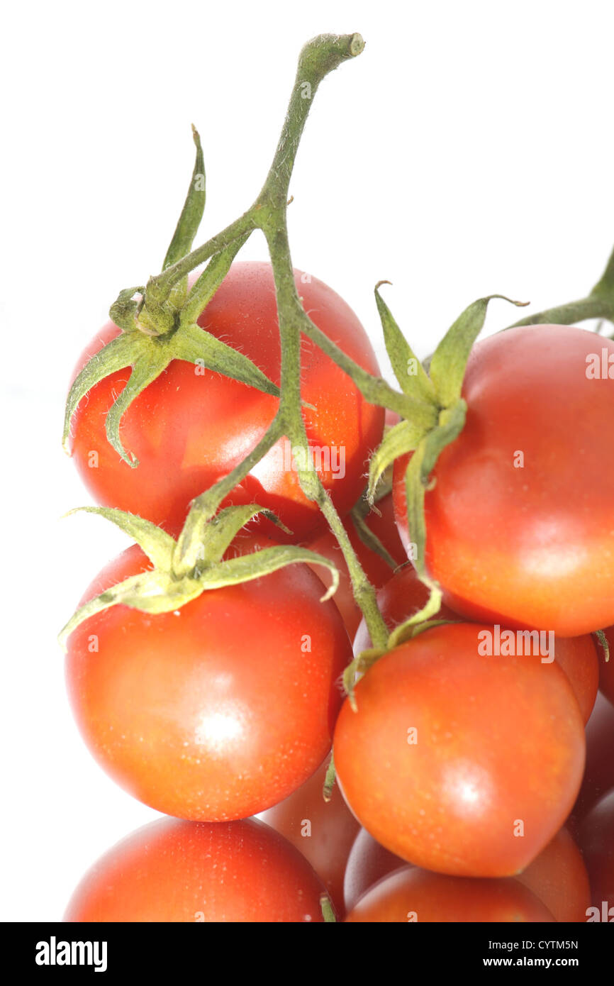 Red tomatos isolated on white background Stock Photo - Alamy