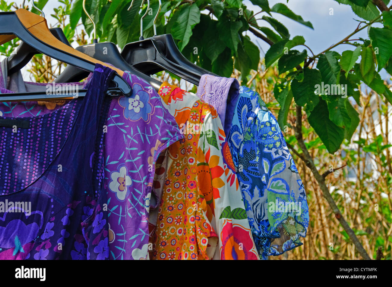 Summer dresses hanging in a garden Stock Photo Alamy