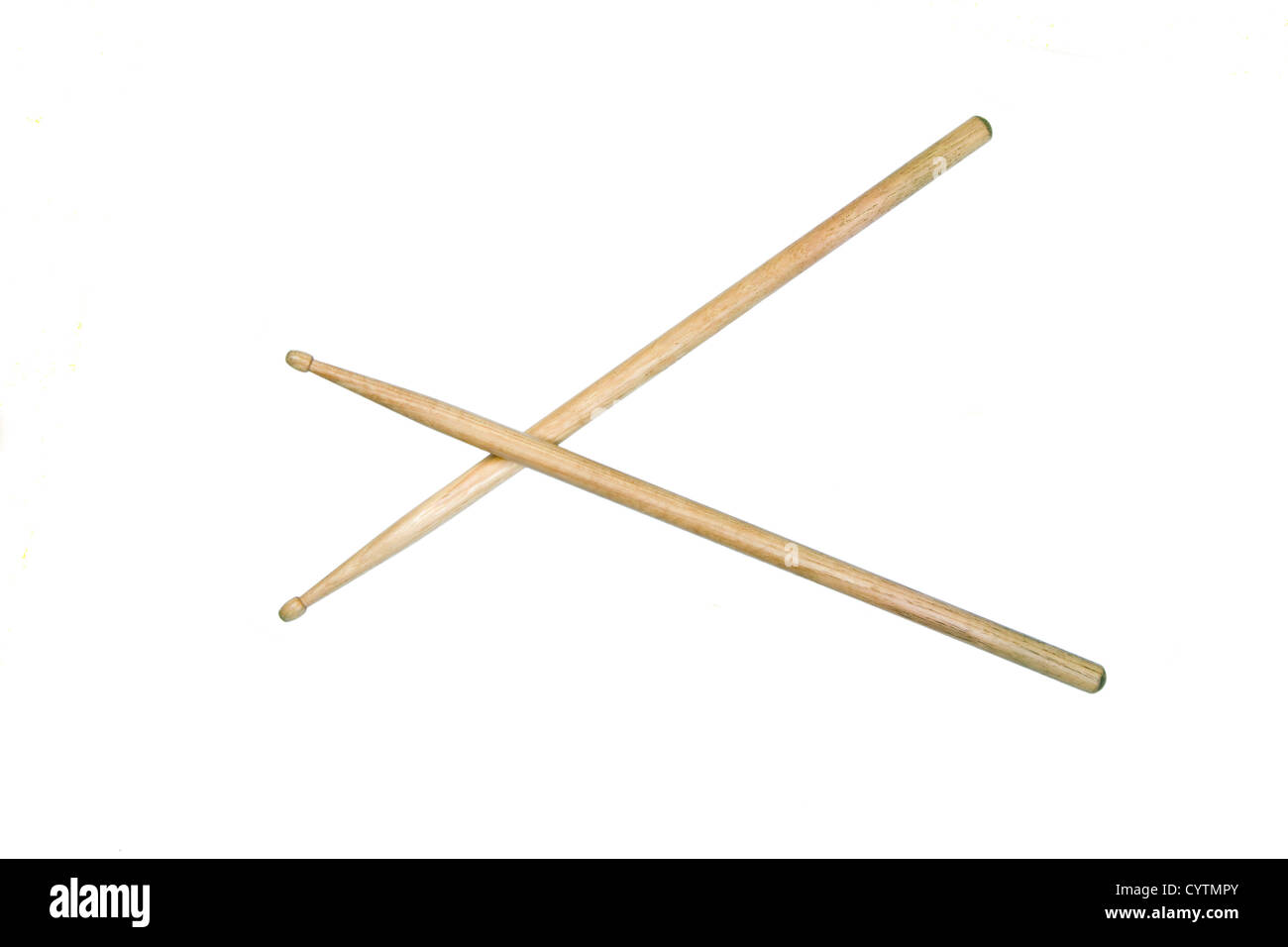 Two drumsticks crossed and isolated over white with clipping path Stock