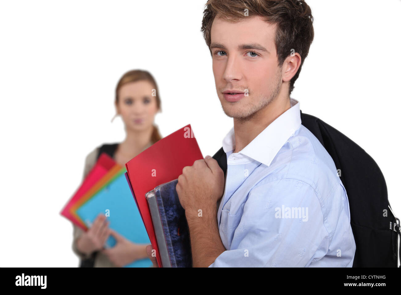 Two students carrying schoolwork Stock Photo - Alamy