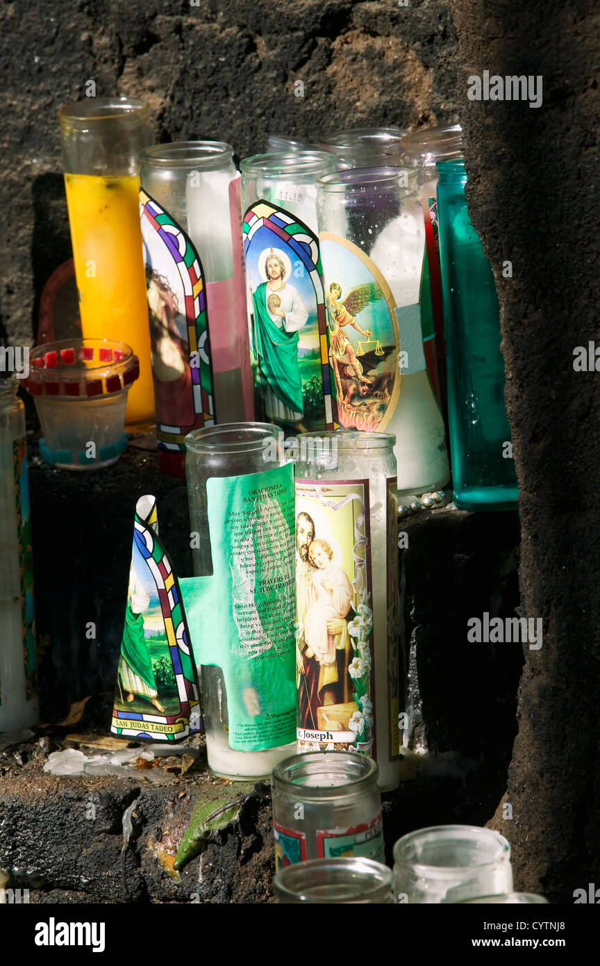Catholic devotional candles on an outdoor stone altar Stock Photo Alamy