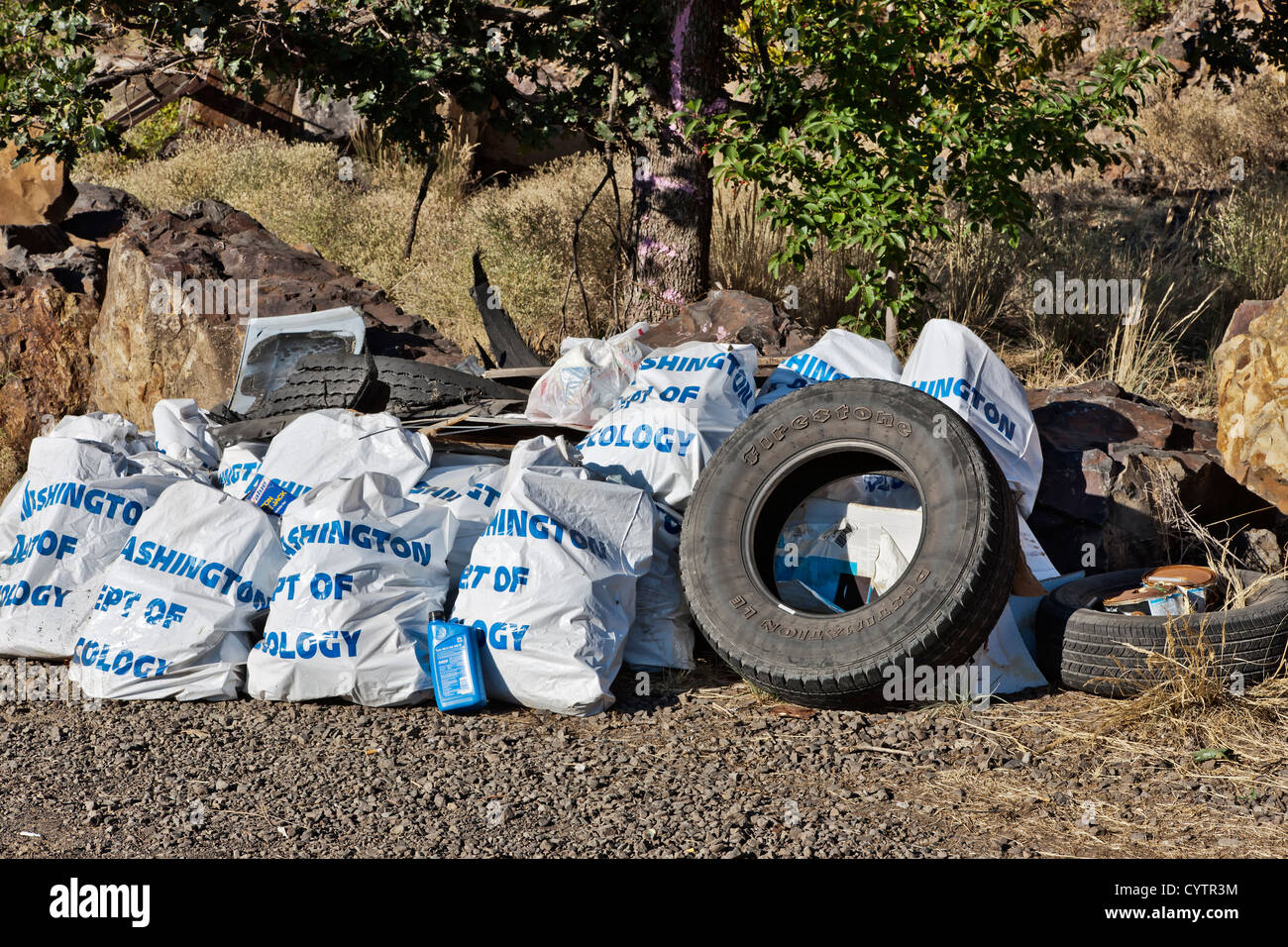 Trash collected along Washington State highway. Stock Photo