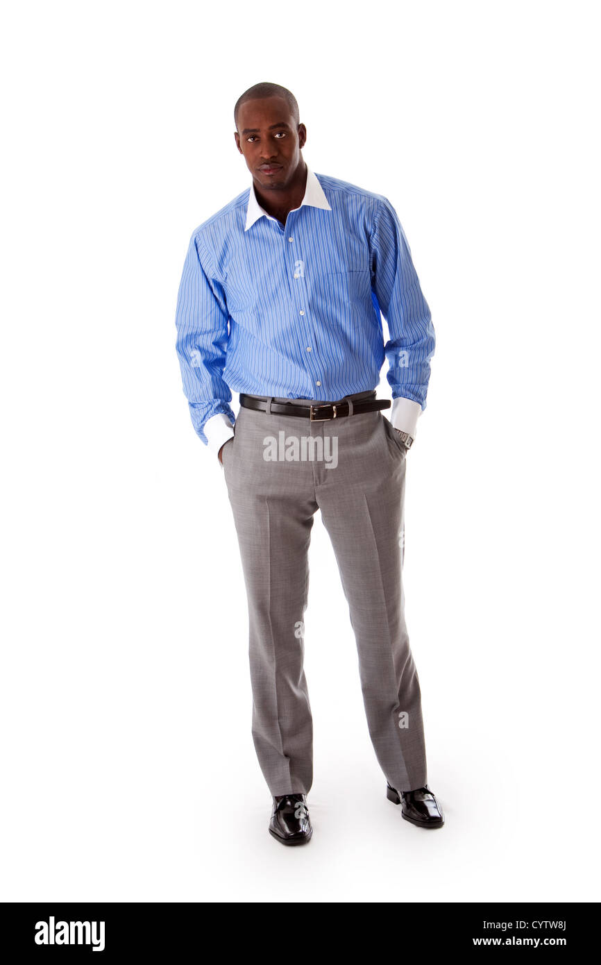 Handsome African American business man standing tilted with hands in ...