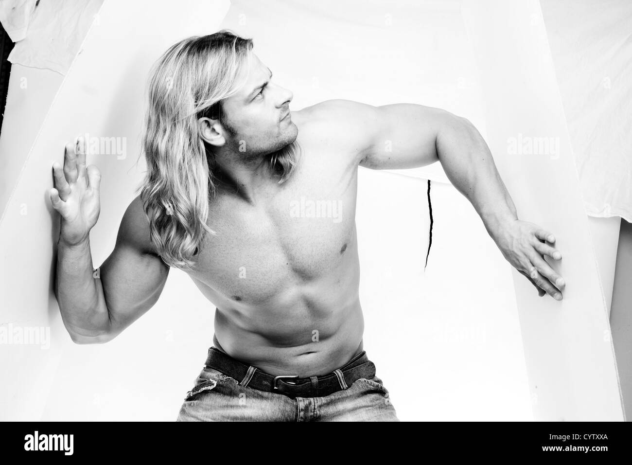 Athletic Sexy Male Body Builder With The Blonde Long Hair