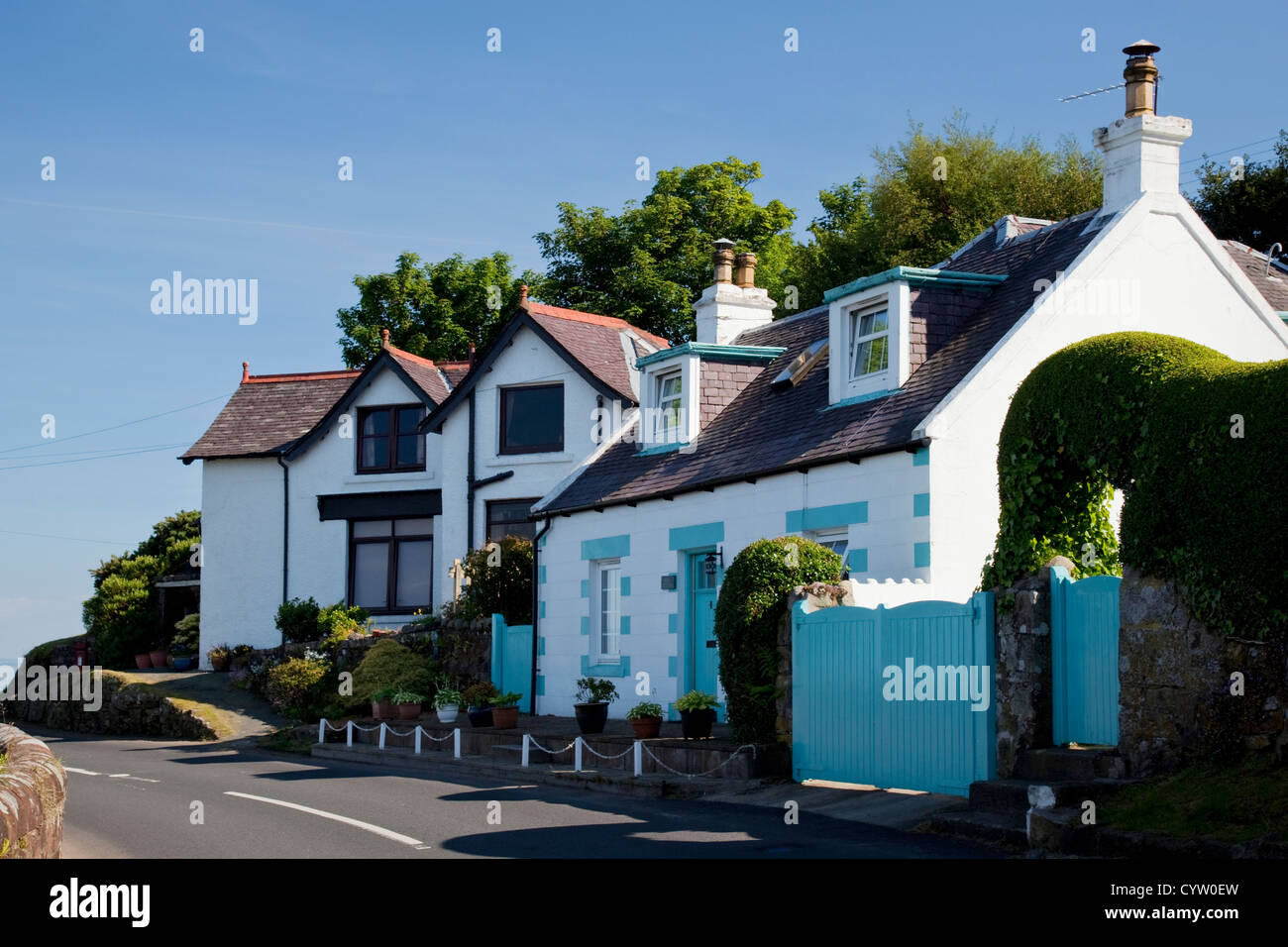 View of two houses alongside the road in the coastal village of Corrie