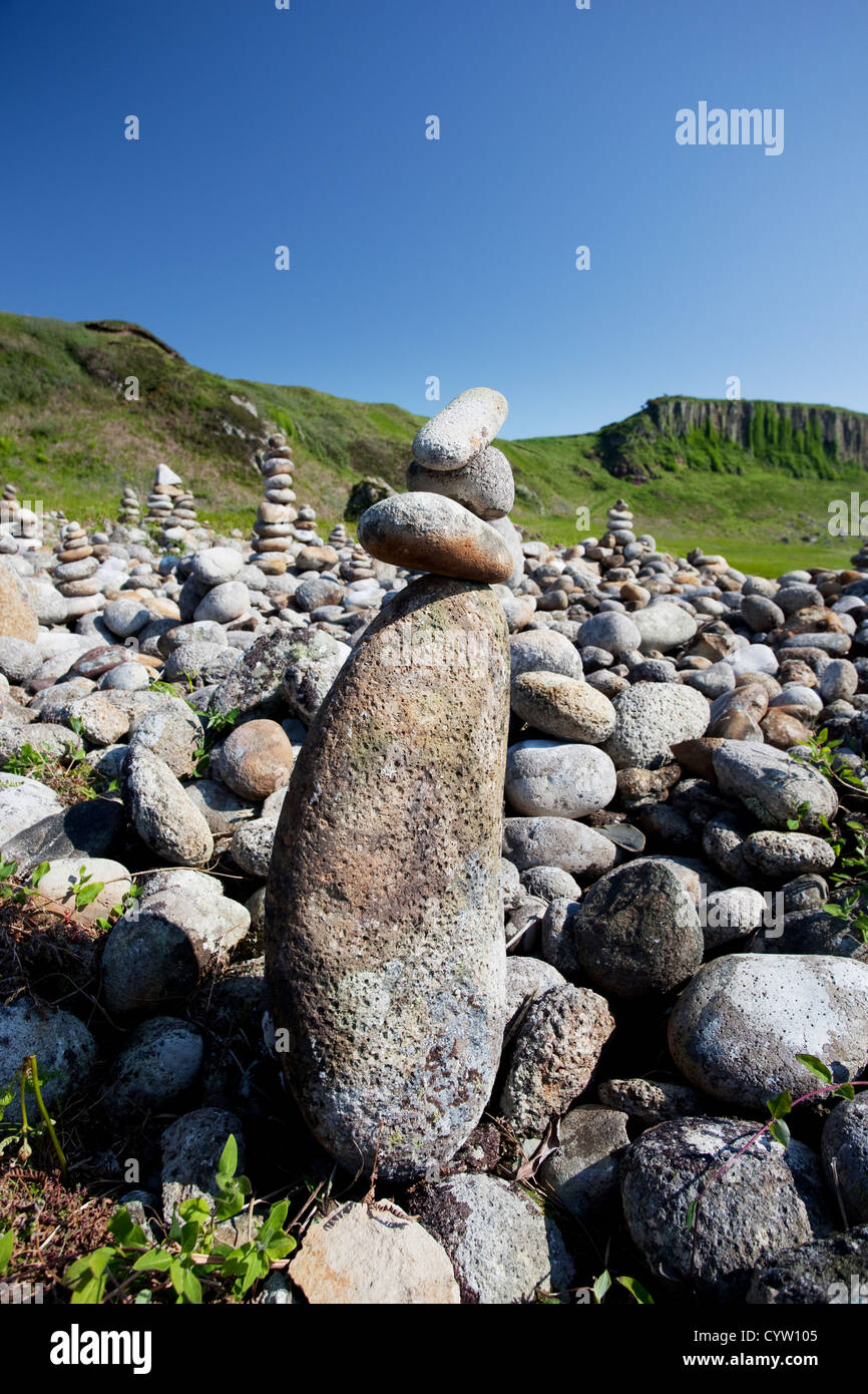 Piles of stones on the beach at Drumadoon near Blackwaterfoot, Isle of Arran, Scotland, UK Stock Photo