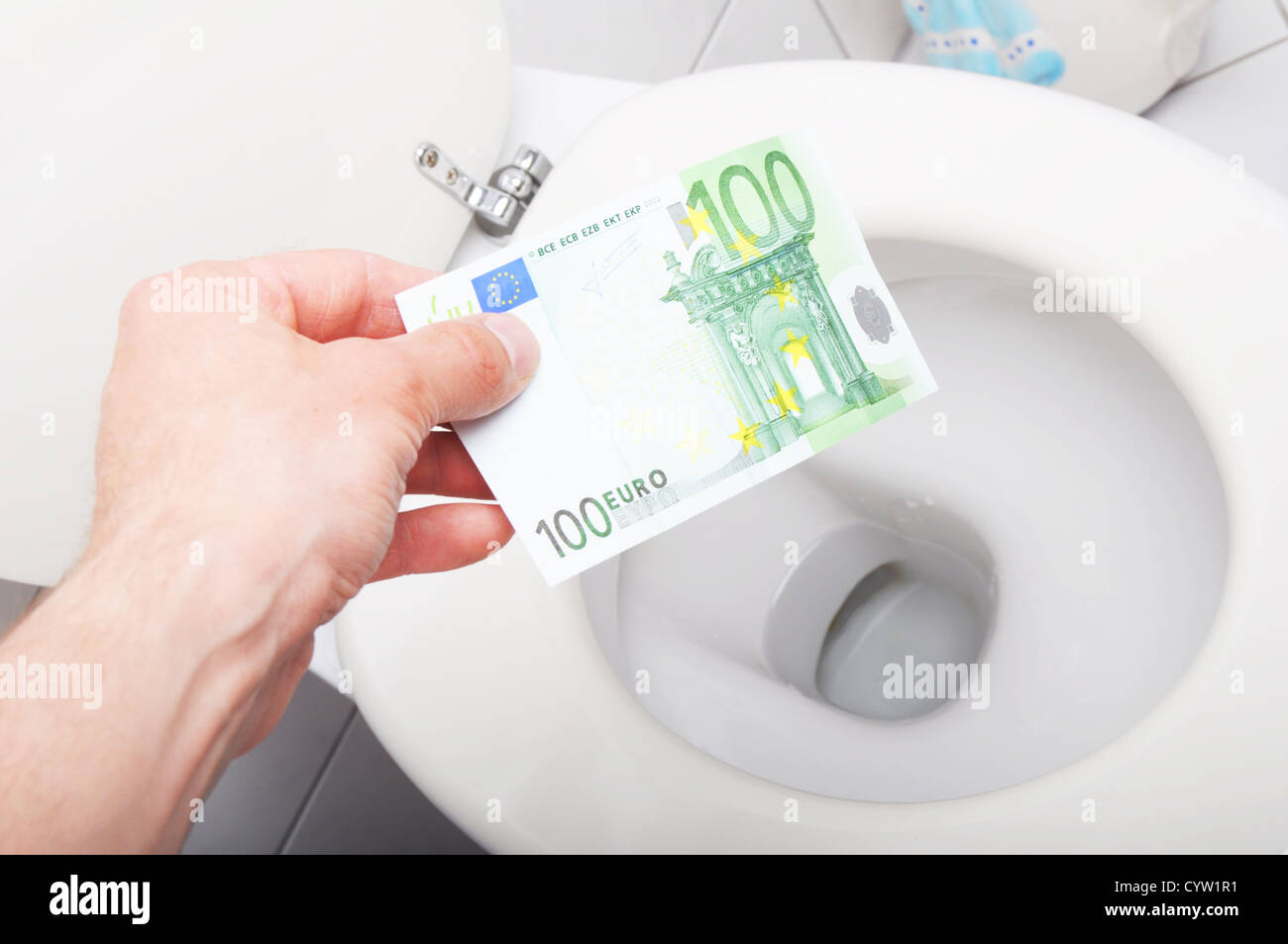 waste of money concept with euro bill and toilet Stock Photo