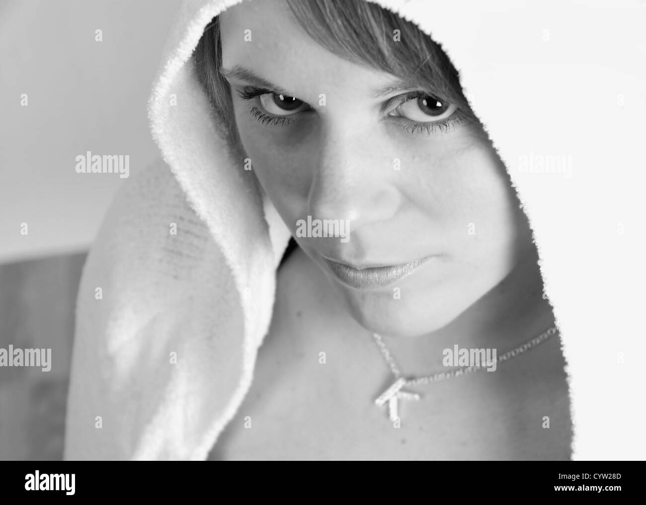 Black and white of a girl in a hoodie. Grunge theme. Stock Photo
