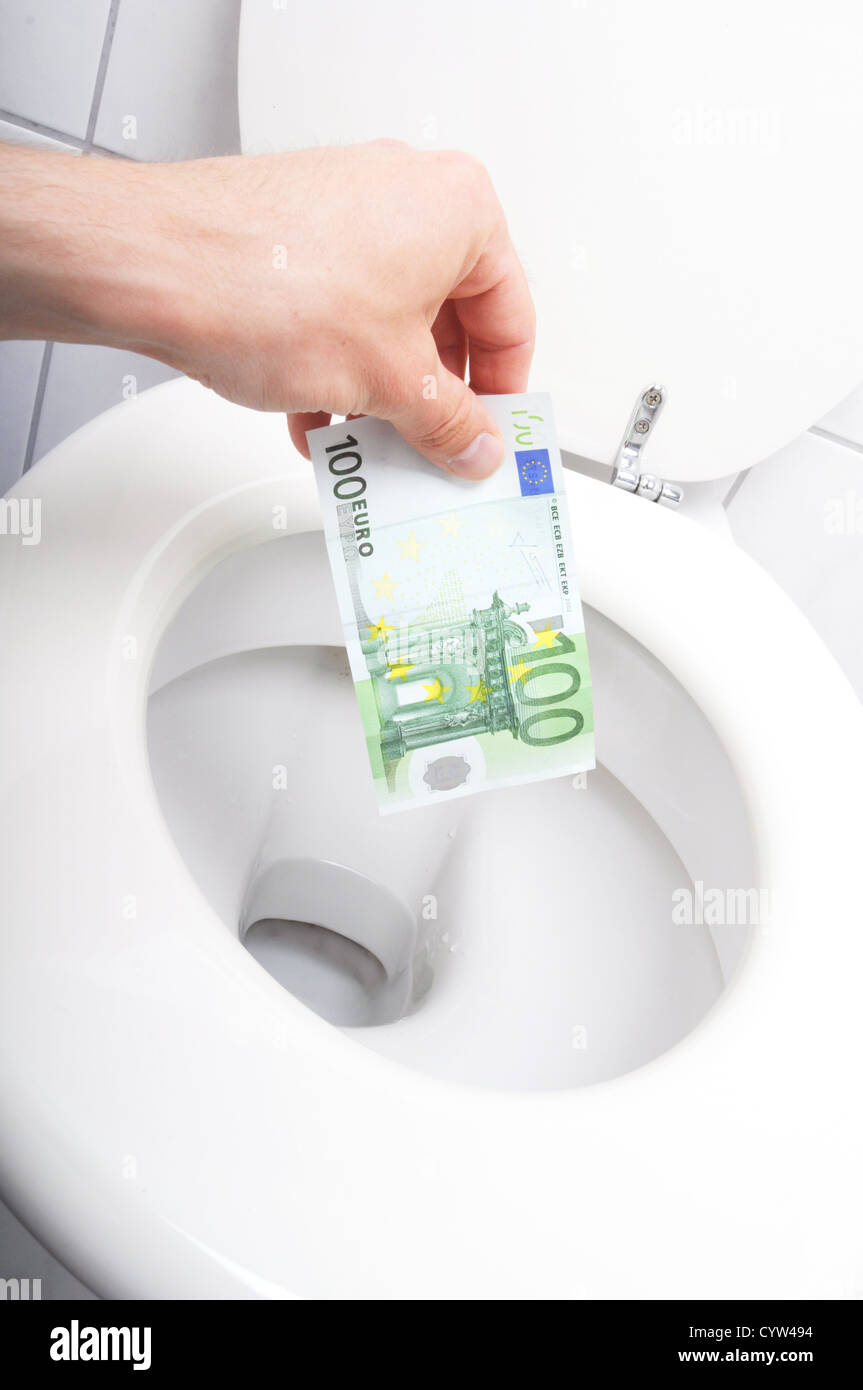 waste of money concept with euro bill and toilet Stock Photo