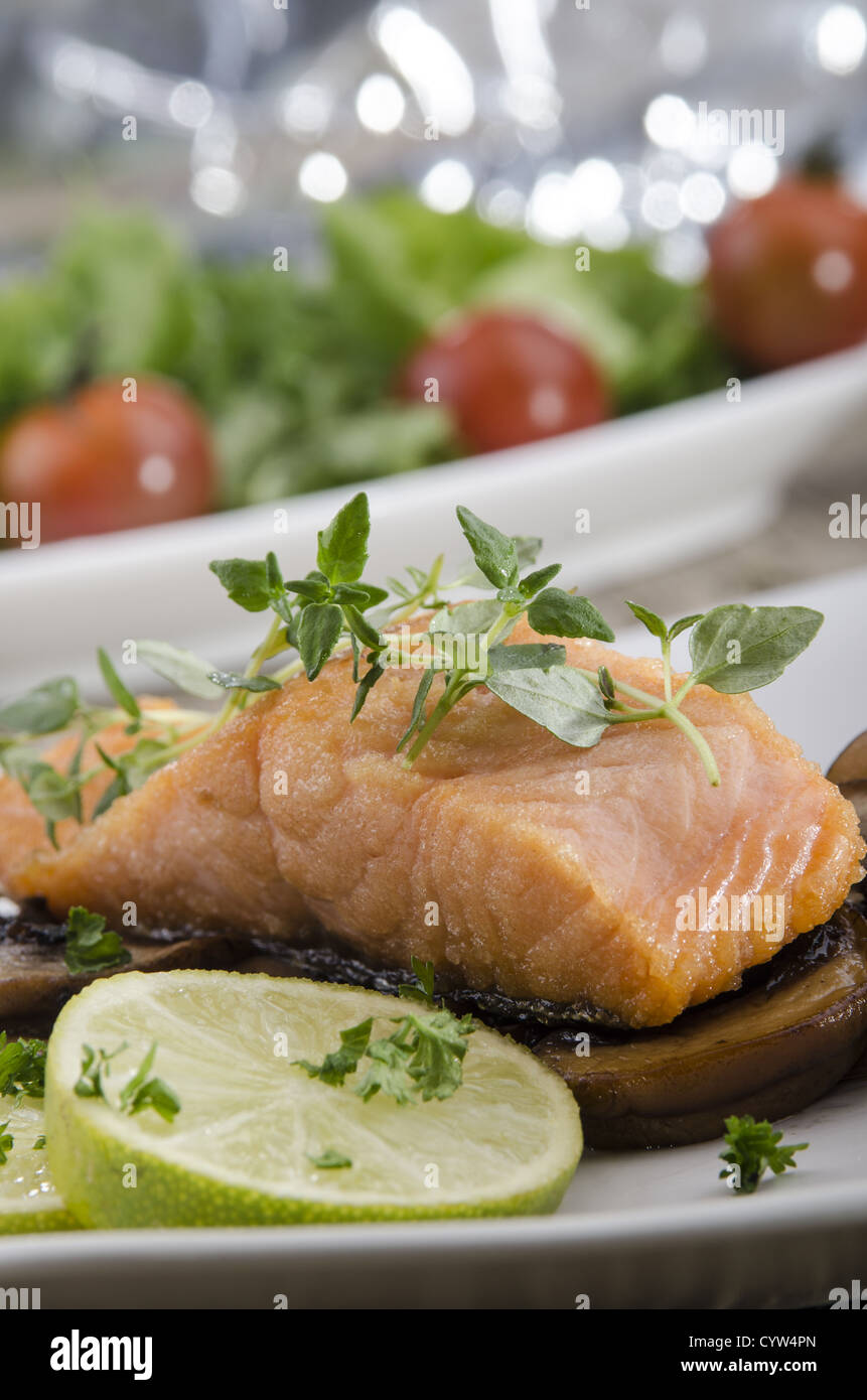 grilled salmon filet with thyme on mushrooms Stock Photo