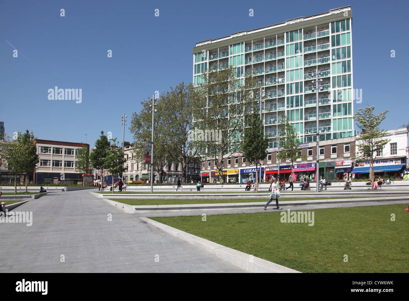 General Gordon Place, Woolwich, UK. A modern, landscaped town square with wide pavements, grass and apartment block to rear. Stock Photo