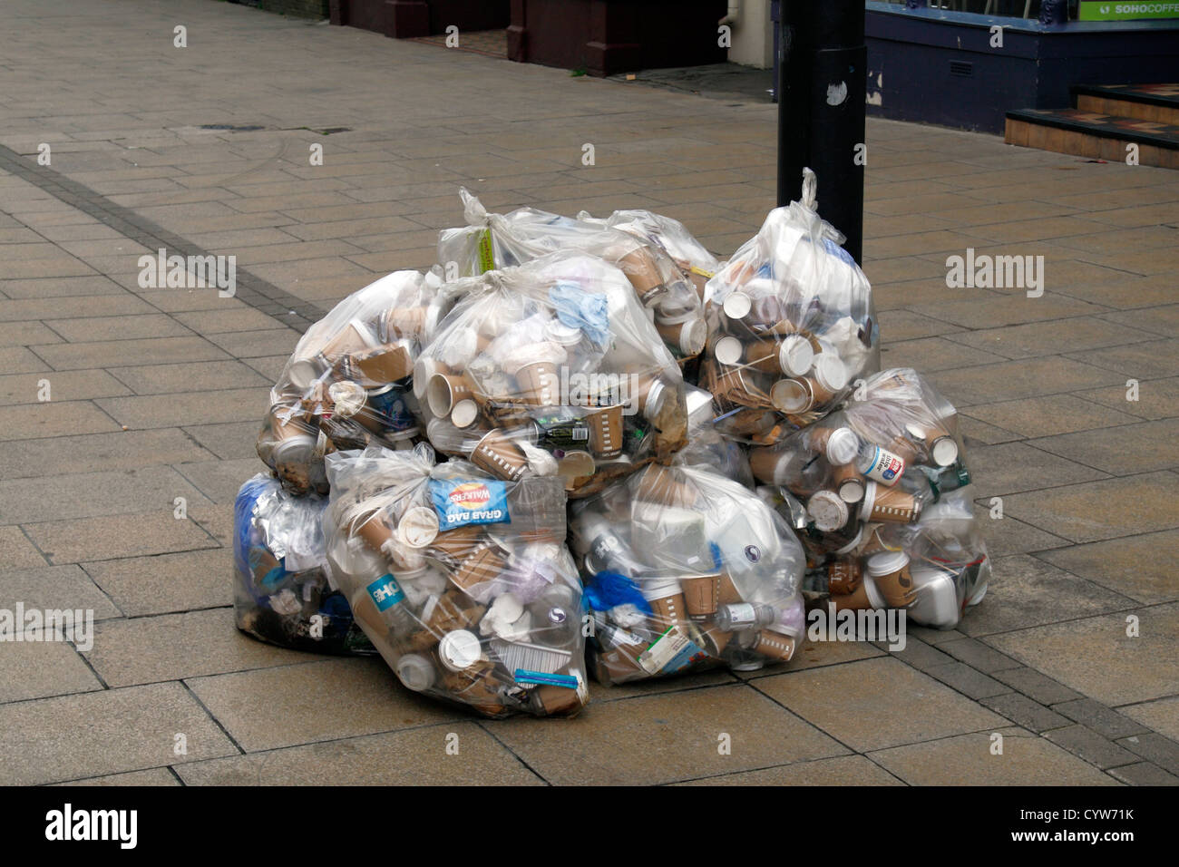 Bags of business waste waiting to be collected by waste collectors in