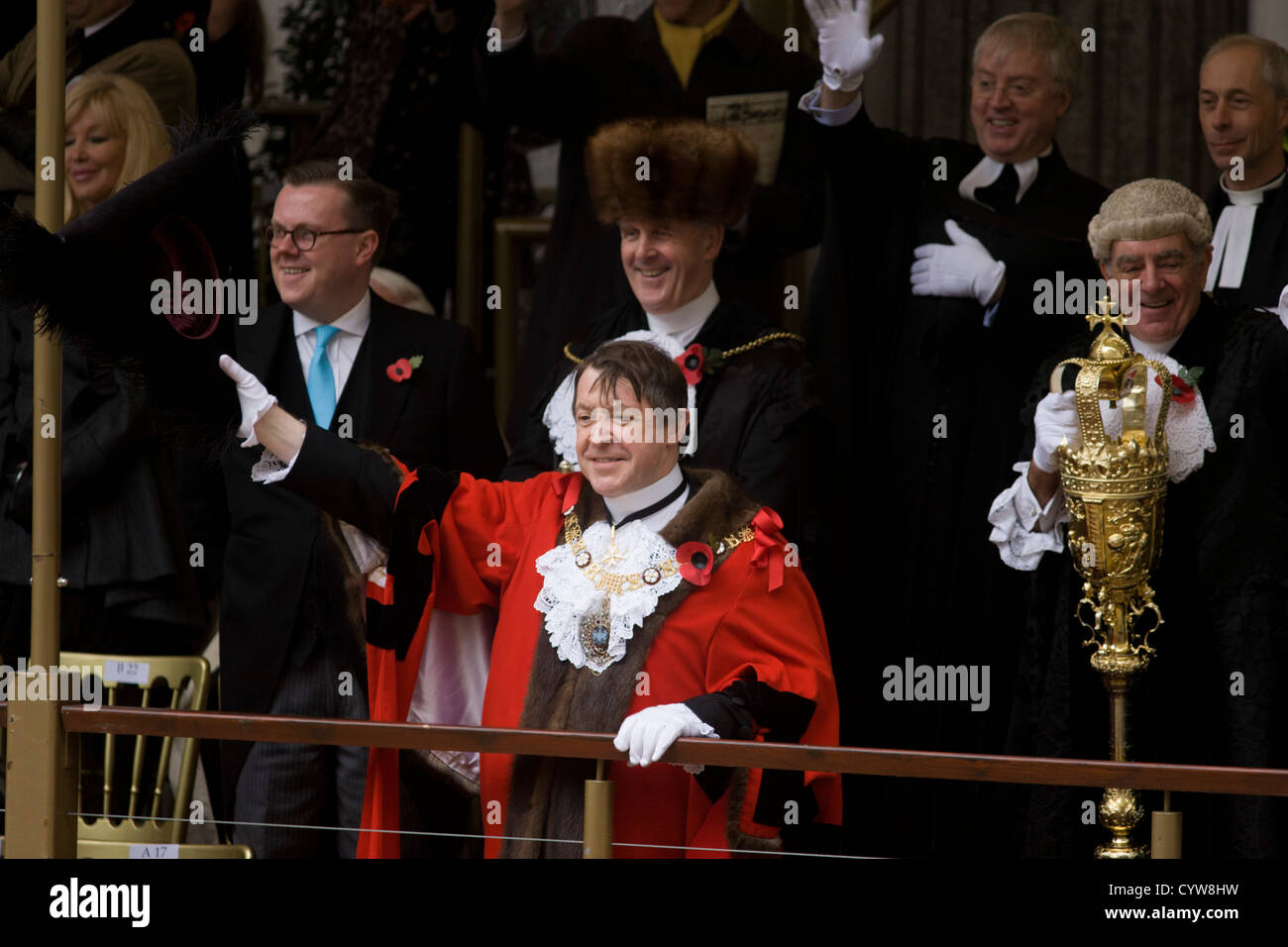 Alderman and Rt Hon The Lord Mayor of London, Roger Gifford (L), a merchant banker with Swedish bank SEB waves to crowds during the Lord Mayor's Show. Stock Photo