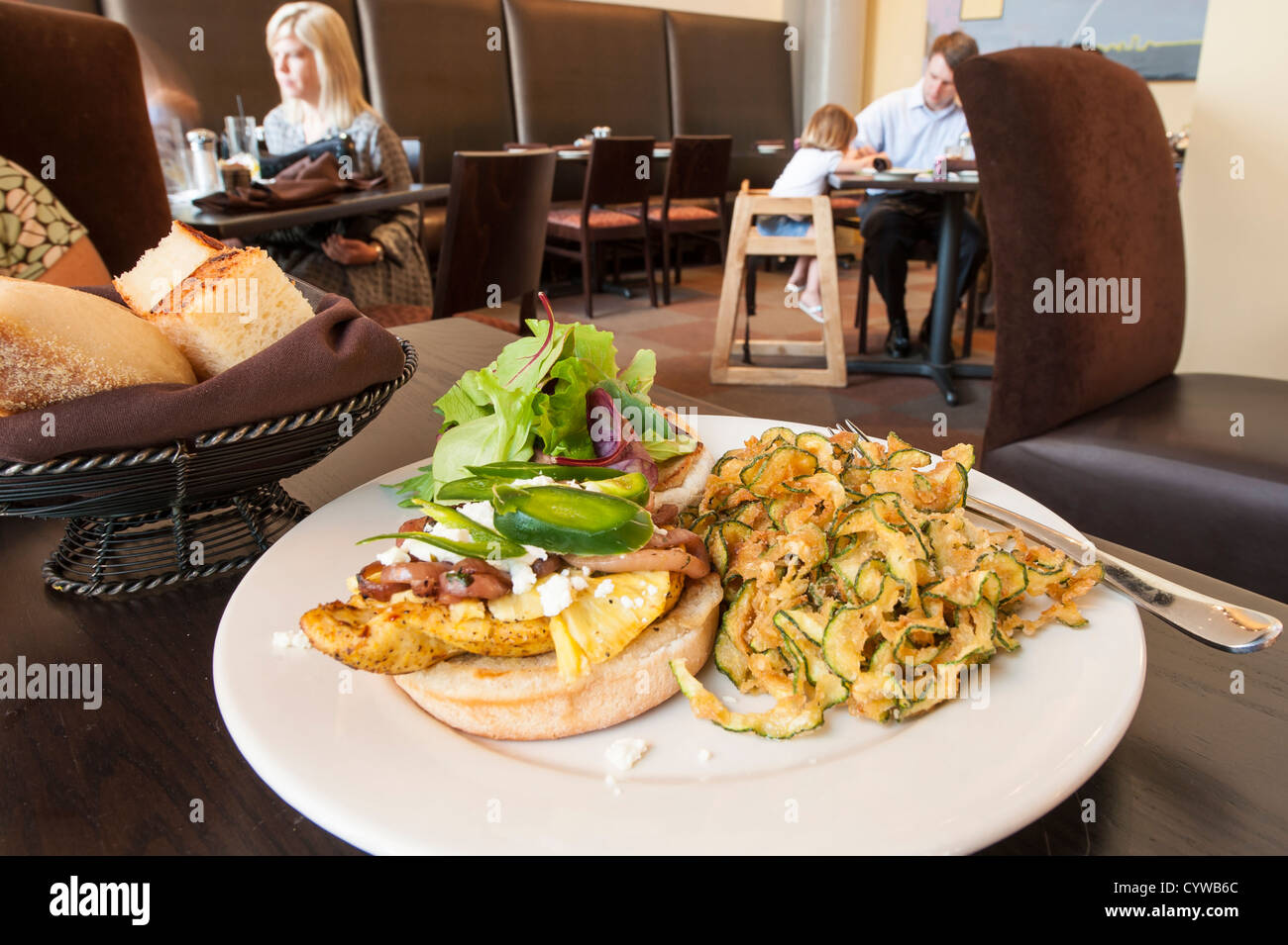 Chicken sandwich with fried zucchini at a restaurant in Orlando, Florida. Stock Photo
