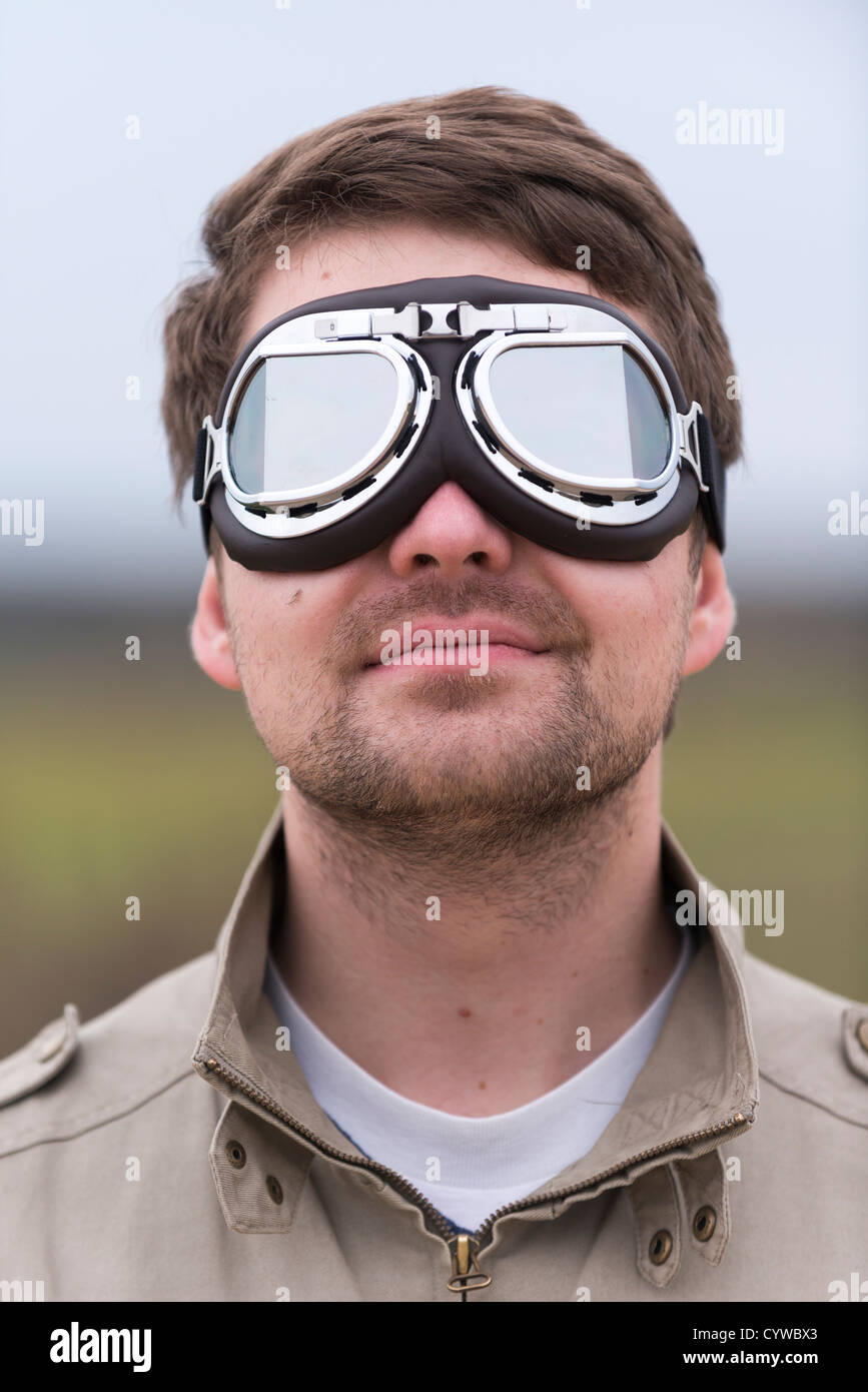 Young man wearing aviator motorcycle glasses Stock Photo