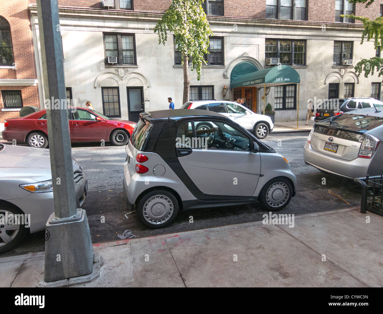 Smart Car parked in small space, Upper East Side, Manhattan, New York City, USA Stock Photo