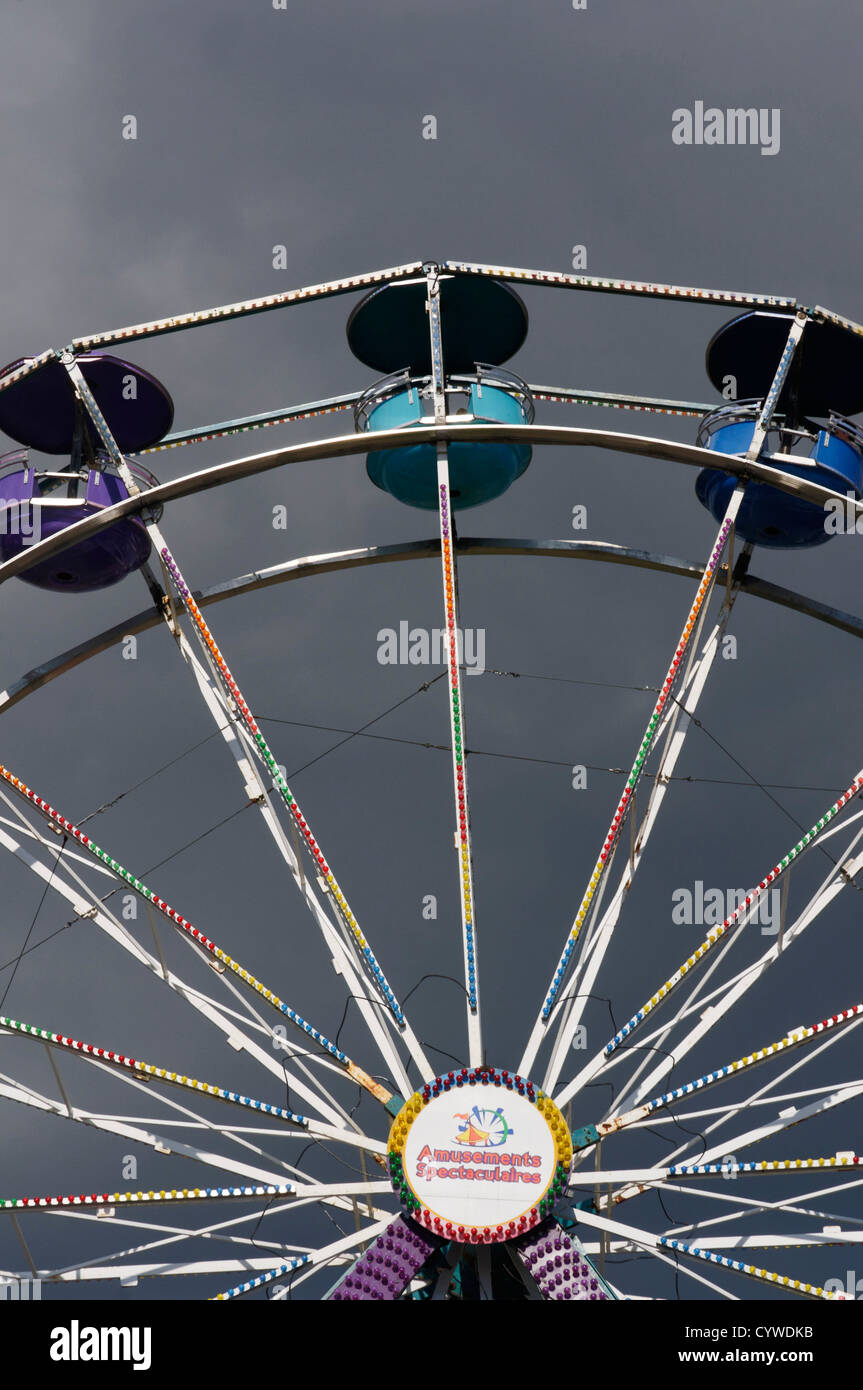 A ferris wheel against a stormy sky Stock Photo