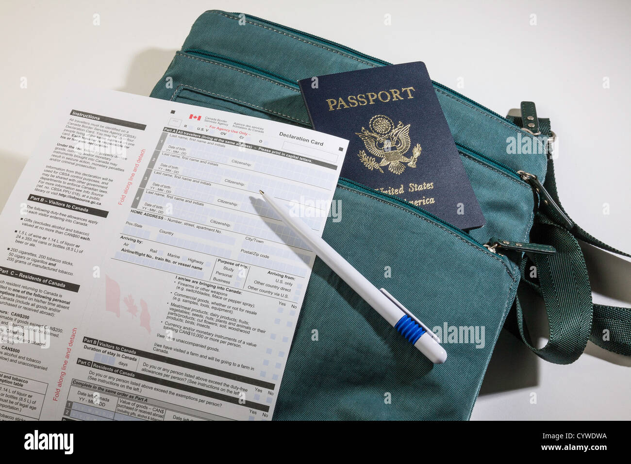 Still Life Travel Bag and US Passport with Canadian Customs Form Stock Photo