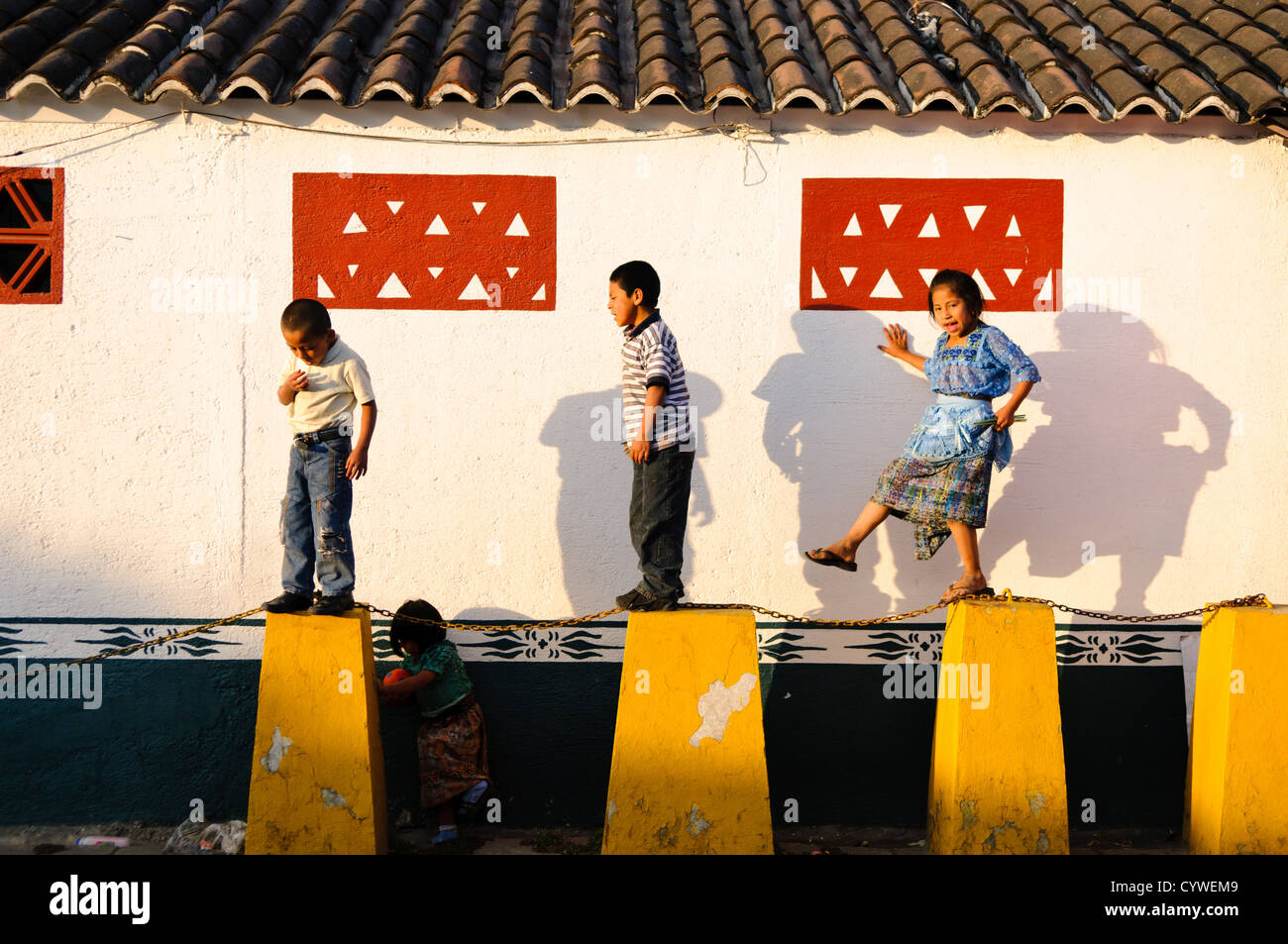 Guatemalan children playing. Famous for its well-preserved Spanish baroque architecture as well as a number of ruins from earthquakes, Antigua Guatemala is a UNESCO World Heritage Site and former capital of Guatemala. Stock Photo