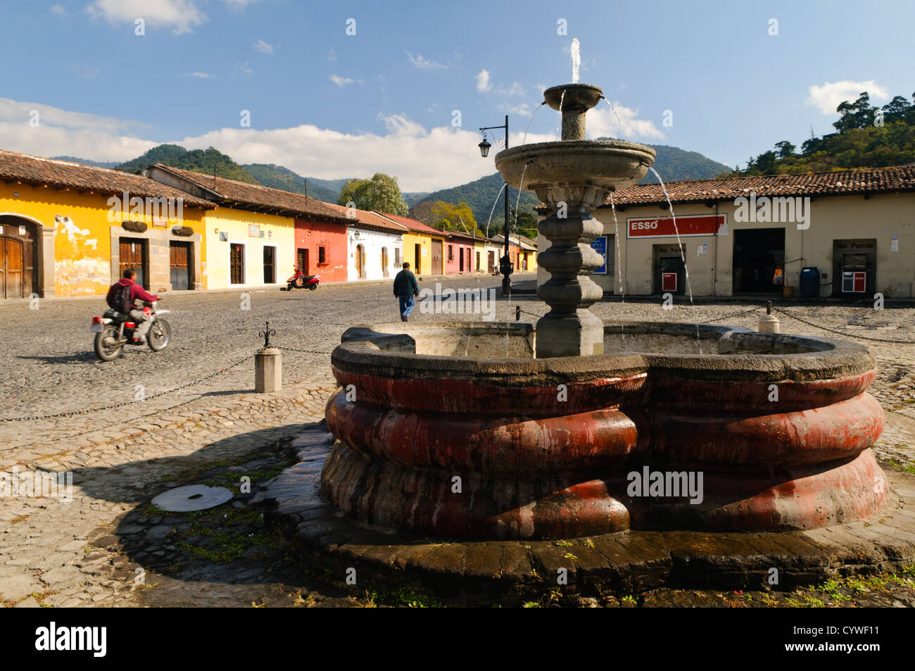 A Spanish colonial fountain on a cobblestone street in Antigua, Guatemala. Stock Photo