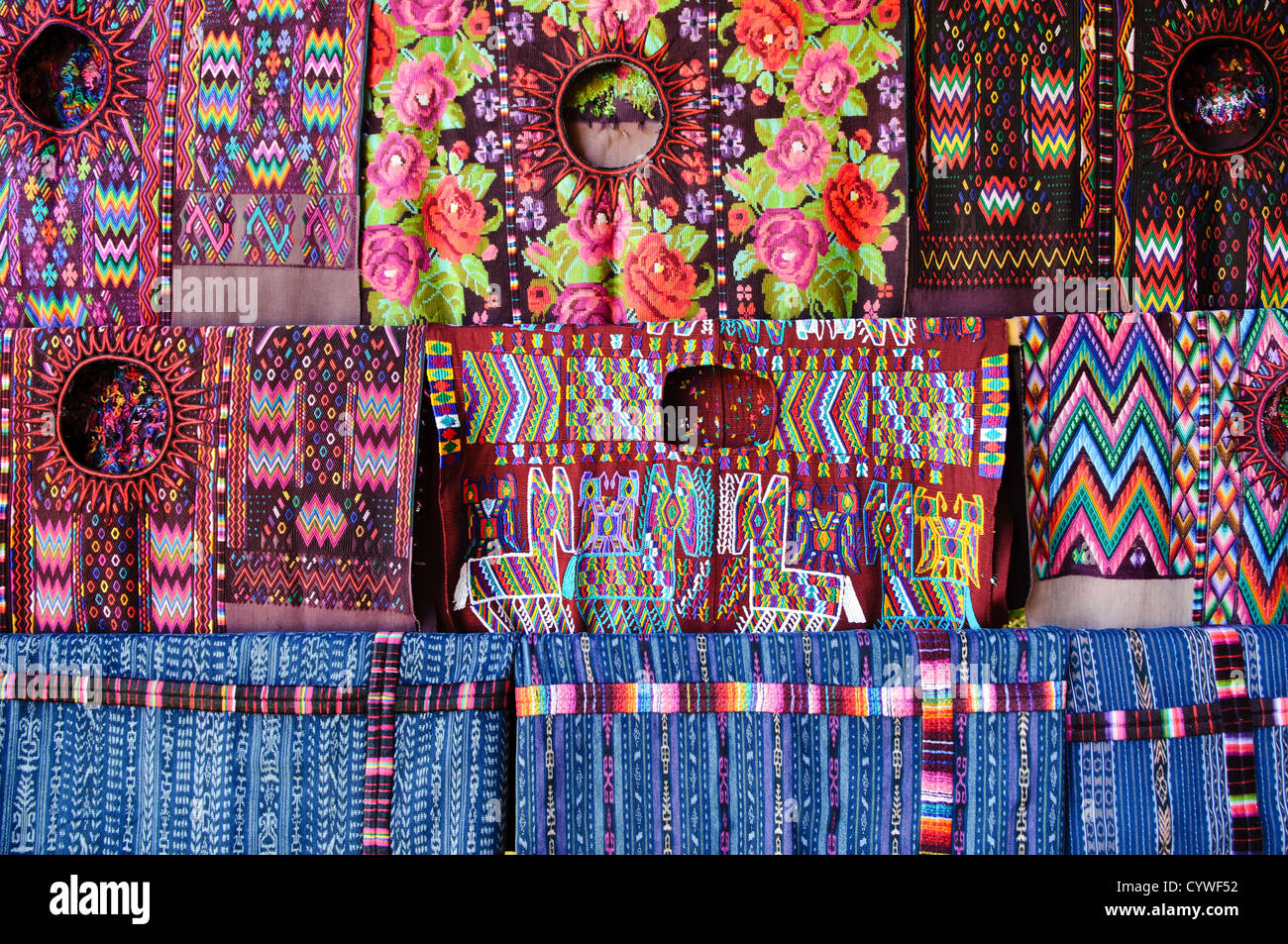CHICHICASTENANGO, Guatemala - Traditional local woven textiles for sale at the market in Chichi. Chichicastenango is an indigenous Maya town in the Guatemalan highlands about 90 miles northwest of Guatemala City and at an elevation of nearly 6,500 feet. It is most famous for its markets on Sundays and Thursdays. Stock Photo