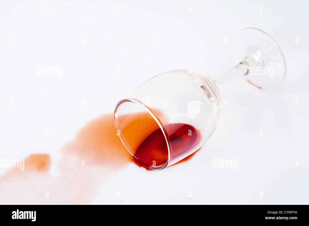 Spilled red wine glass isolated on white background Stock Photo - Alamy