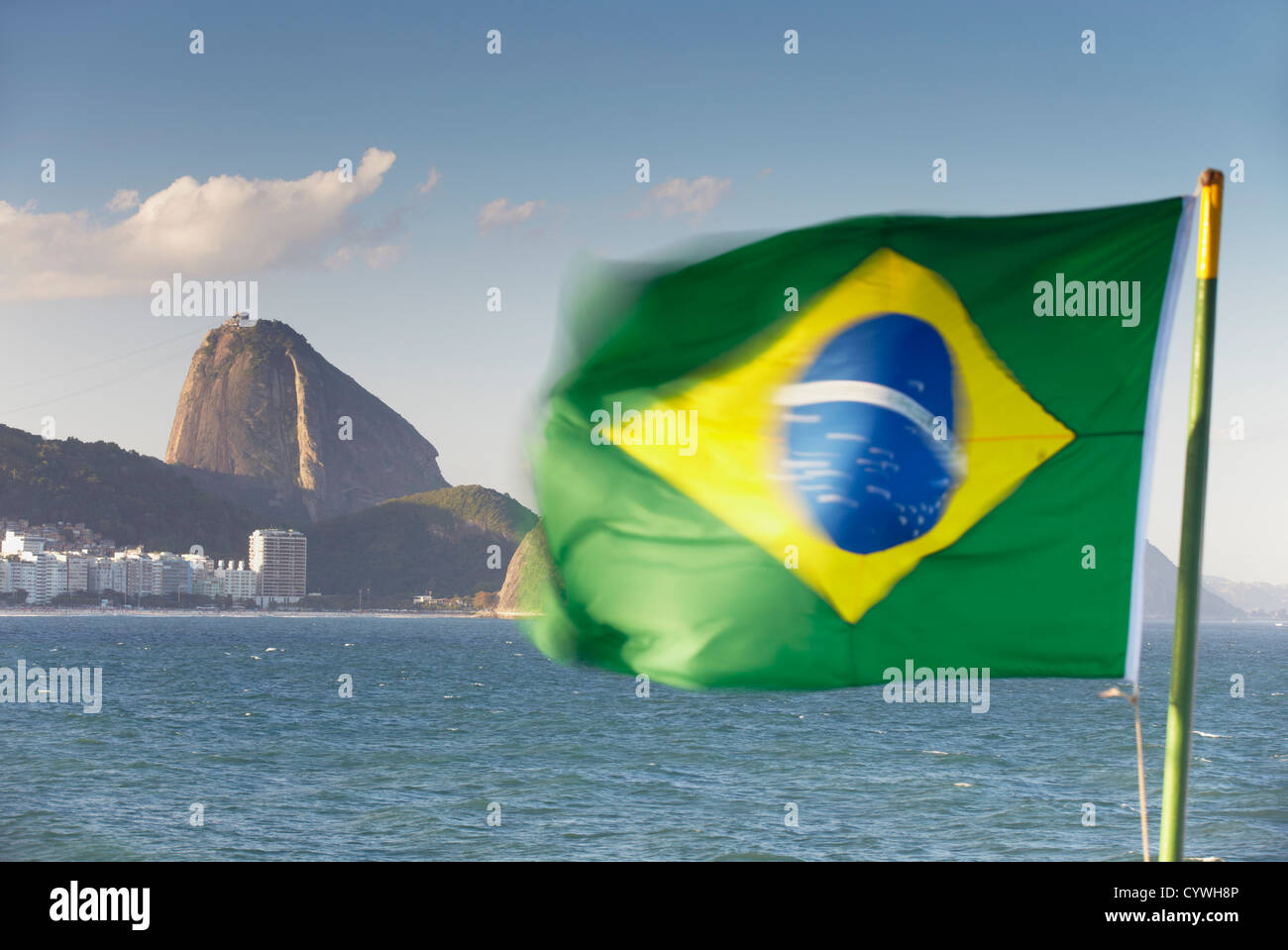 Sugar Loaf Mountain (Pao do Acucar) and Brazlian flag, Rio de Janeiro, Brazil Stock Photo