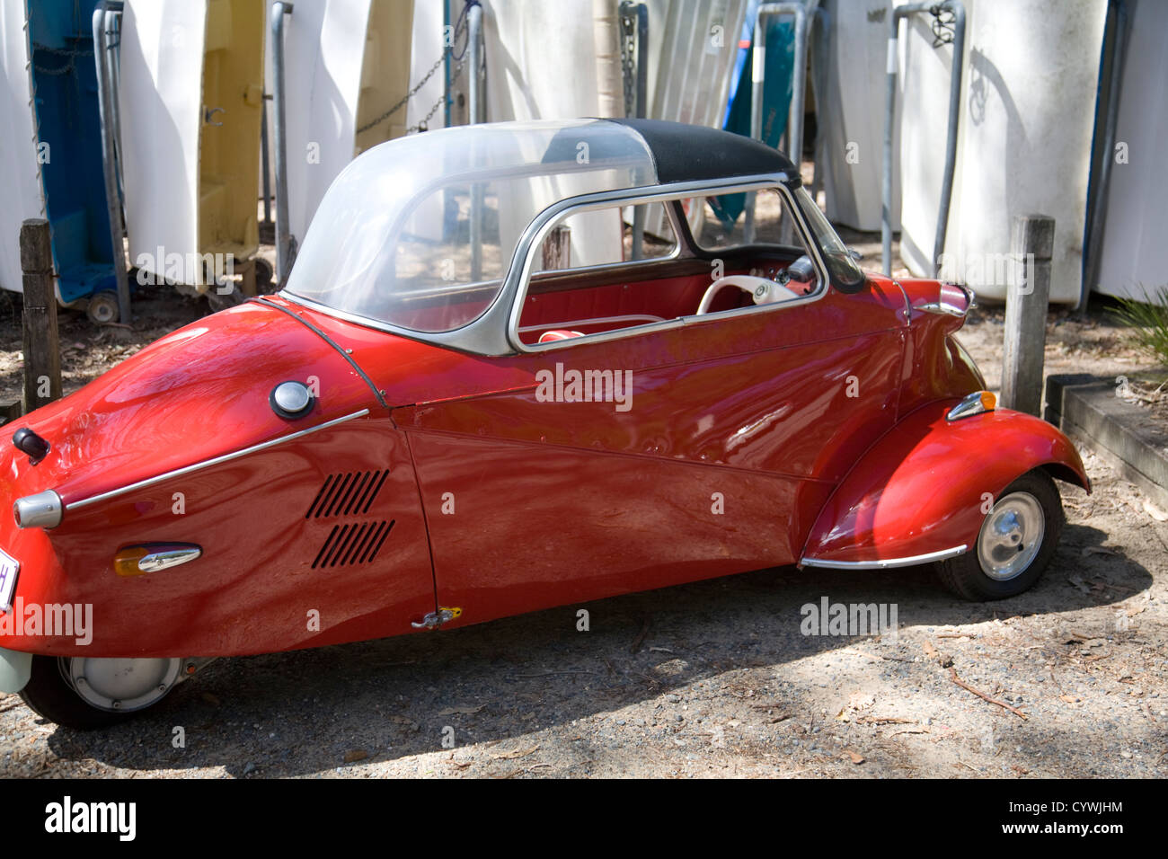 Messerschmitt kr200 car parked by stored boats in clareville,sydney Stock Photo