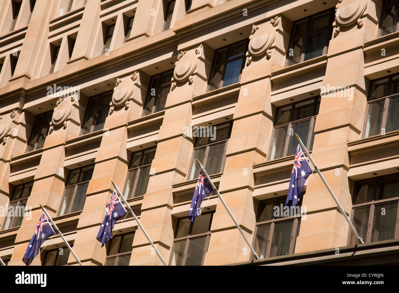 australian flags on flagpoles fly in martin place, sydney Stock Photo