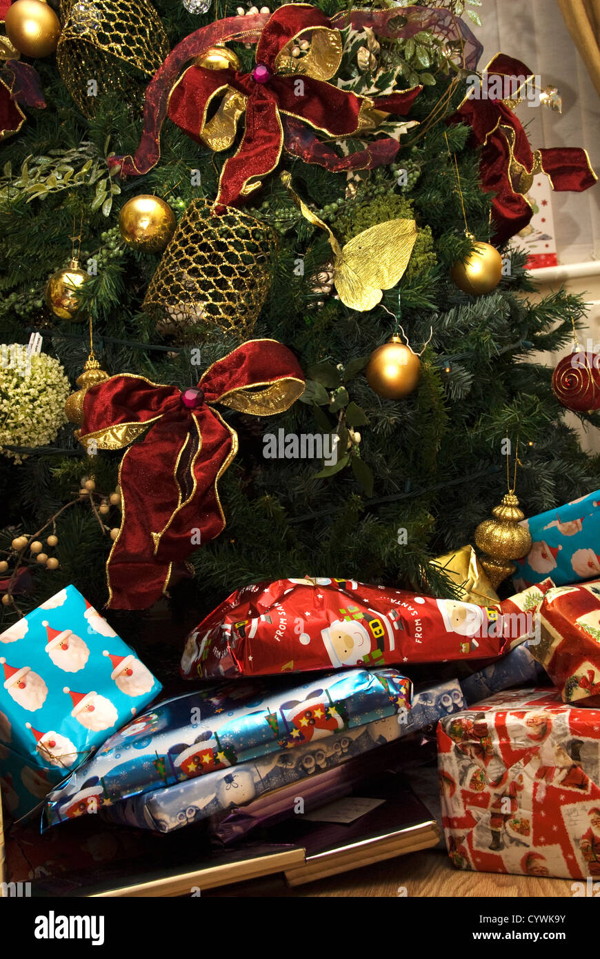 Christmas presents underneath a Christmas tree Stock Photo Alamy