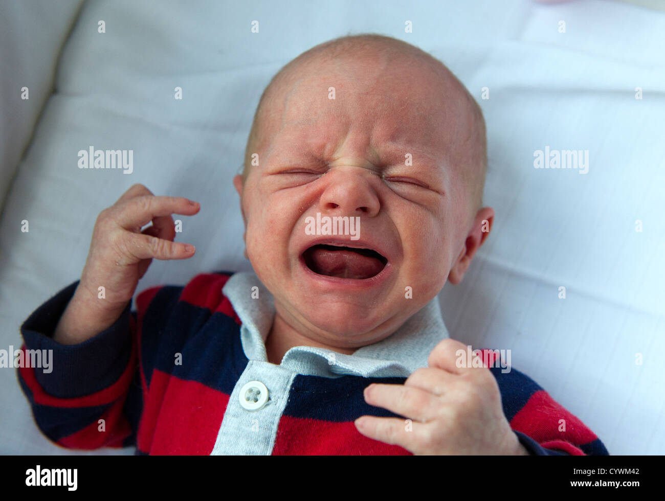 A crying new born baby Stock Photo - Alamy