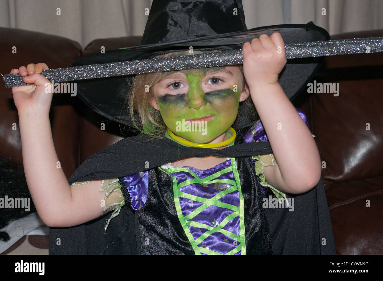 5 Year Old Girl Child Dressed In A Witches Costume Outfit  Halloween Stock Photo