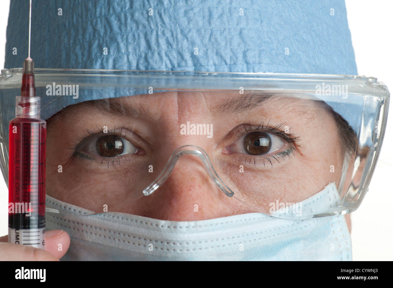woman surgery doctor holding hypodermic needle Stock Photo
