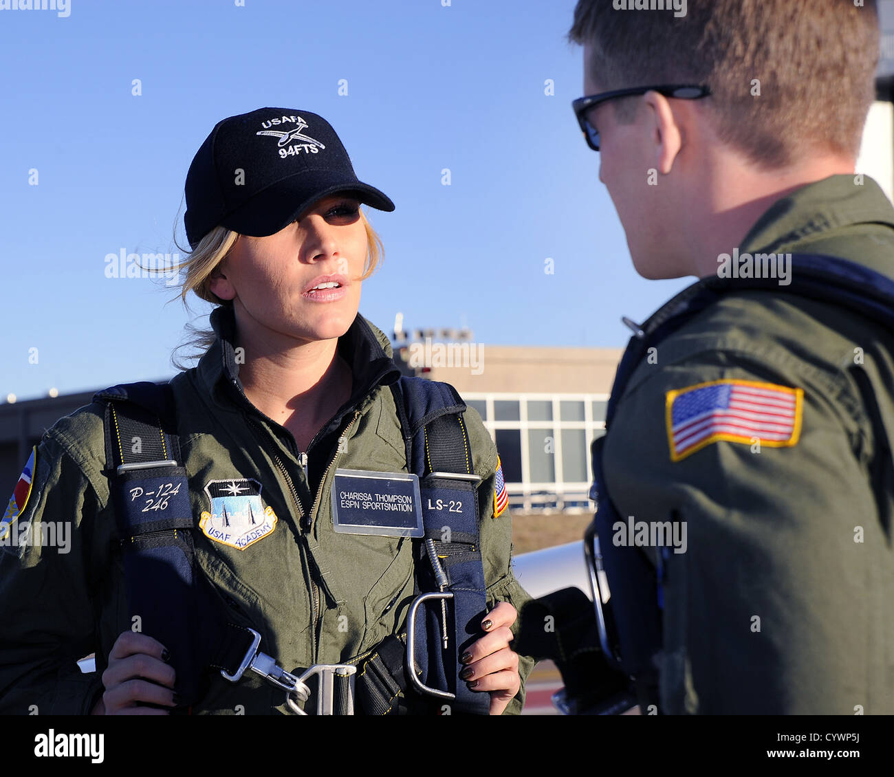 Cadet 1st Class James Bloch, a TG-16A glider Instructor Pilot briefs EPSN's Charissa Thompson before a glider orientation flight at the U.S. Air Force Academy's airfield in Colorado Springs, Colo. Nov. 7, 2012. ESPN broadcast their SportsNation TV show li Stock Photo