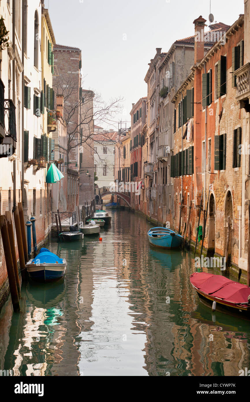 Venetian Canal. Reflections are on the water Stock Photo - Alamy