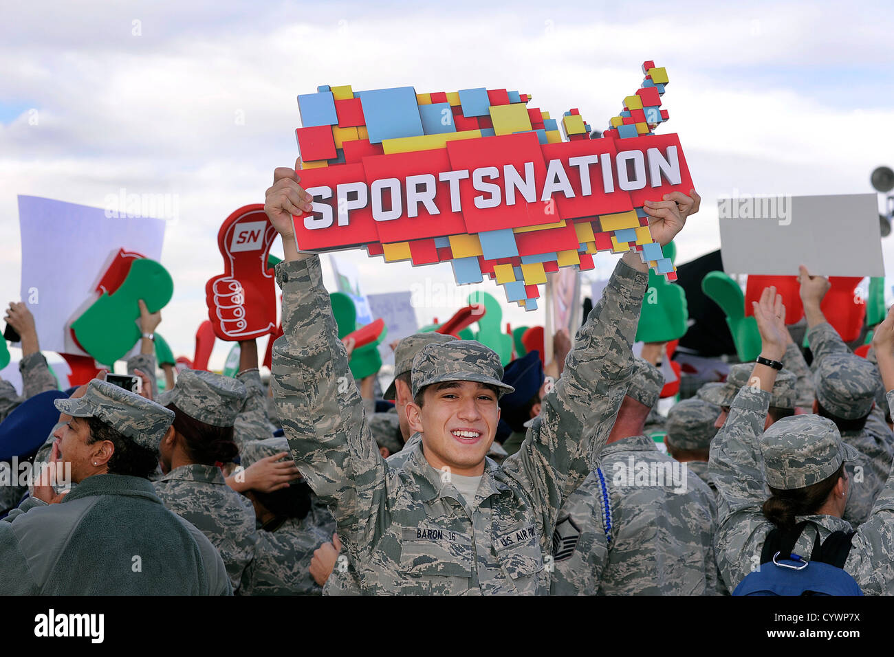 Cadet 4th Class Henry Baron of Cadet Squadron 12 hoists a SportsNation logo during EPSN's SportsNation live broadcast from the U.S. Air Force Academy's terrazzo Nov. 8, 2012 in Colorado Springs, Colo. The live broadcast was a salute to veterans Stock Photo