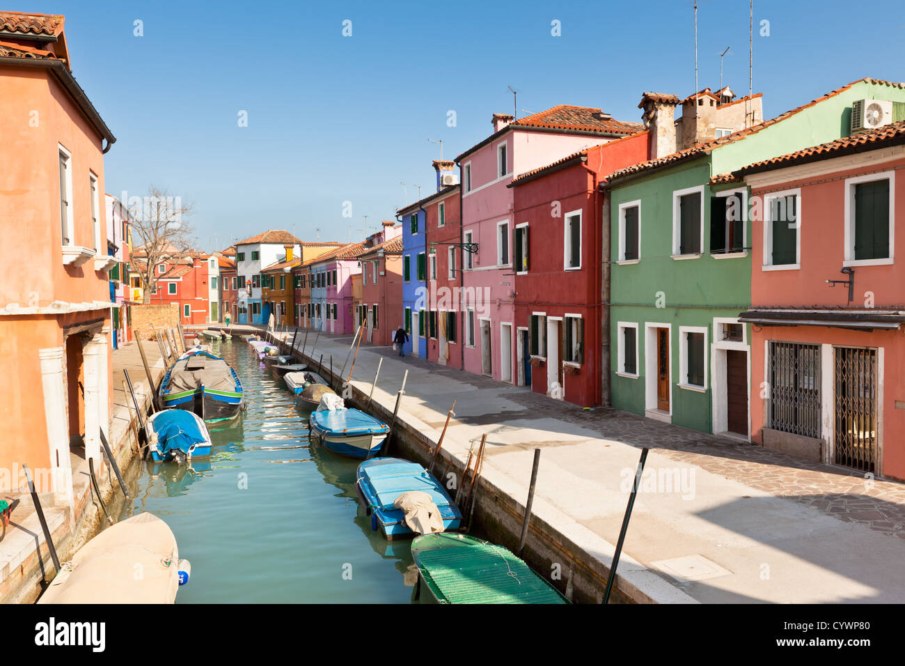 Colorful houses along canal in the island of Burano near Venice, Italy ...