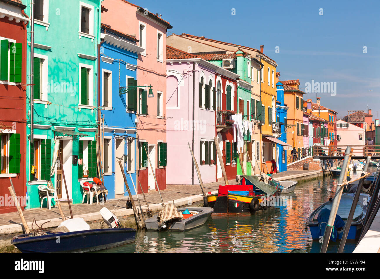 Colorful houses along canal in the island of Burano near Venice, Italy ...