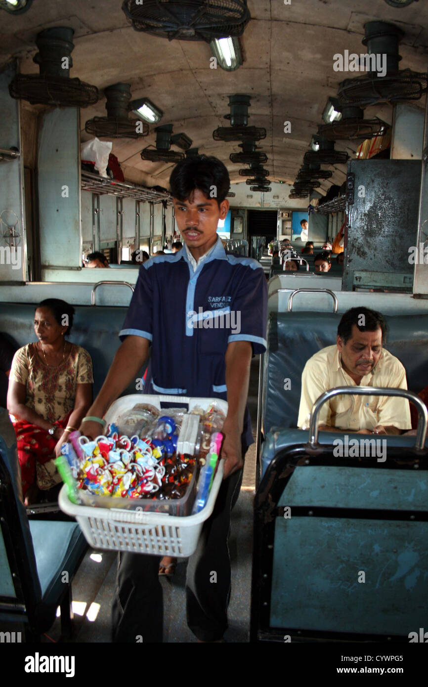 Train vendor between Goa and Karnataka, India. Stock Photo