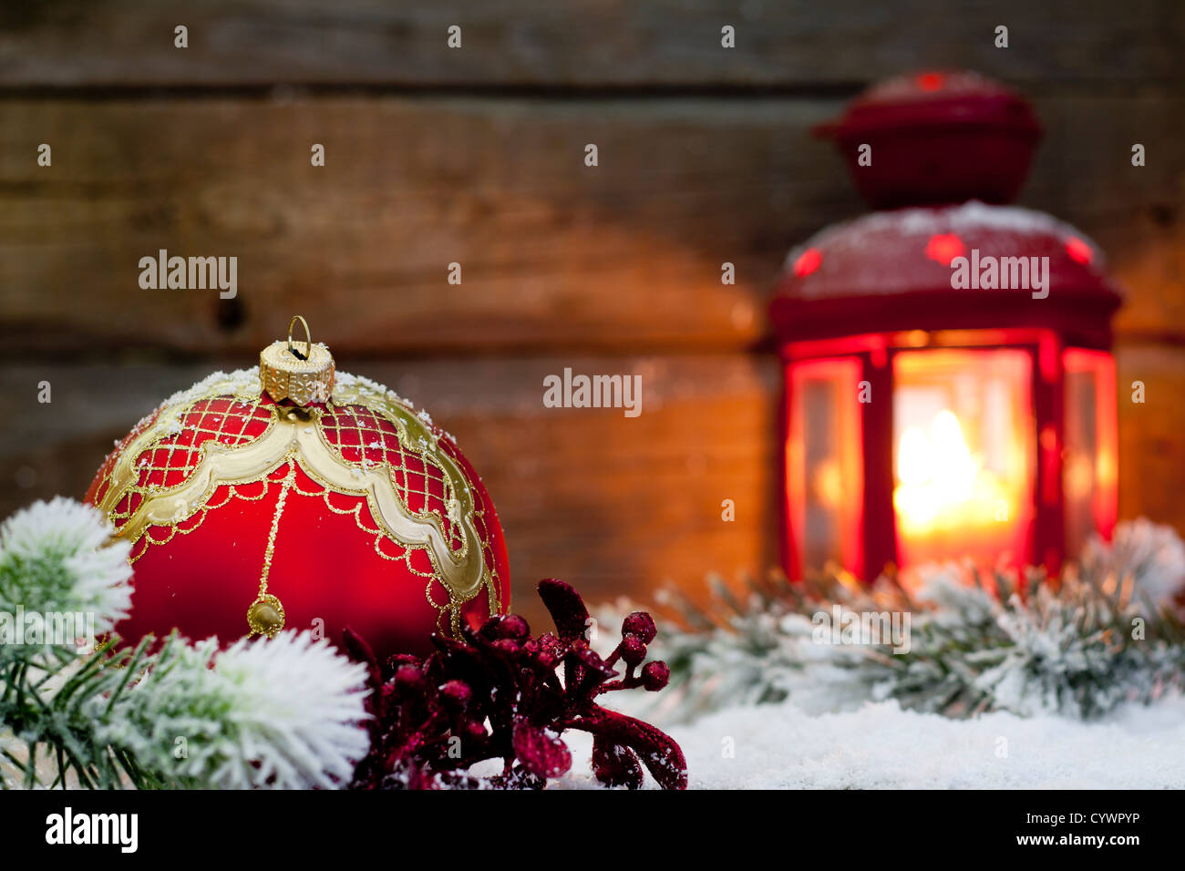 Christmas lantern with baubles on snow abstract background in night Stock Photo